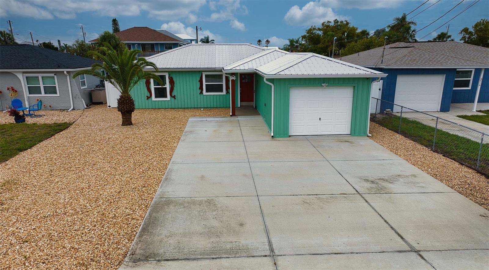 Easy care grounds front and back in addition to oversize parking pad. - 6420 BOATYARD DR, HUDSON