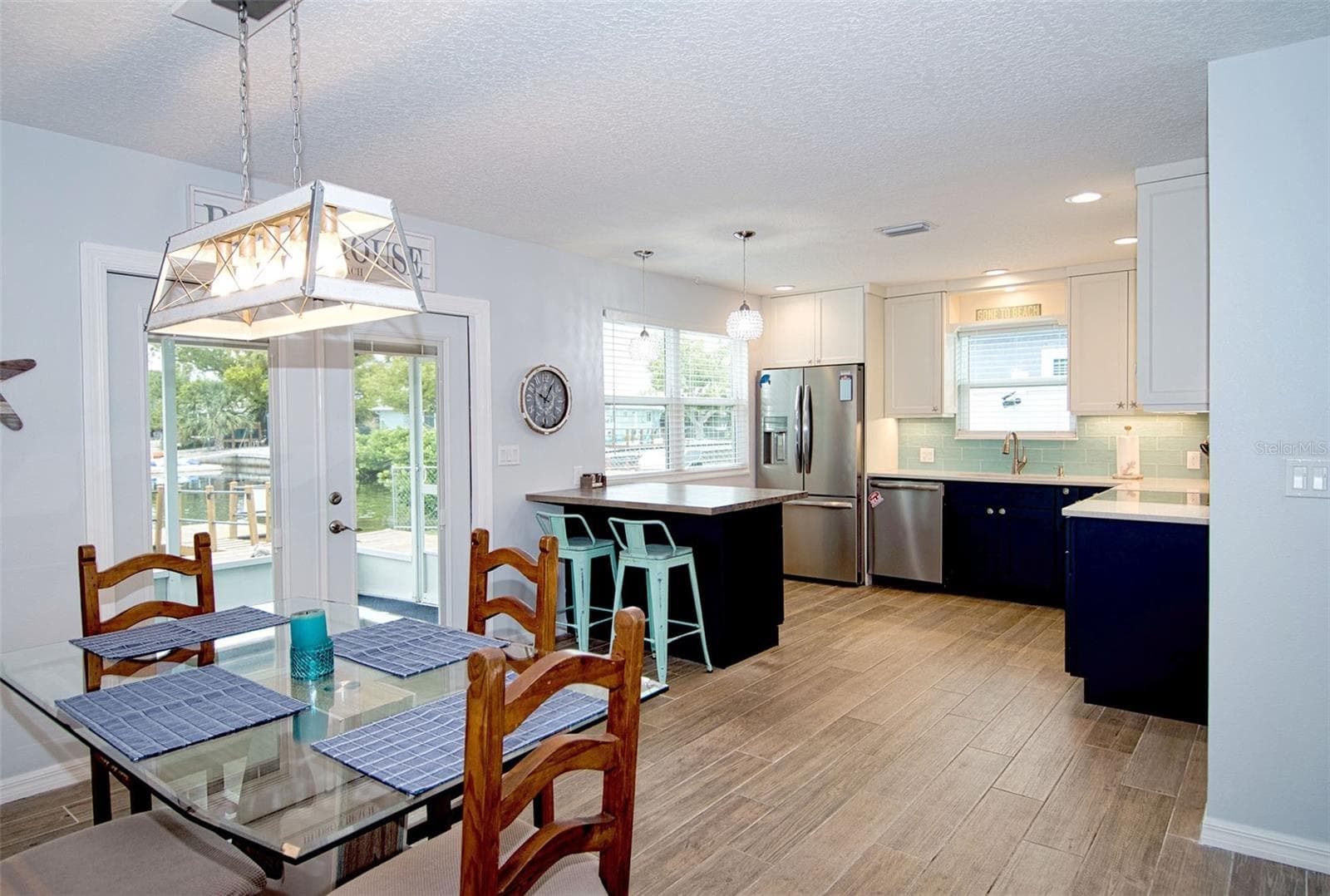 Light and bright with windows and French doors that usher in natural light as well as that coveted water view. - 6420 BOATYARD DR, HUDSON
