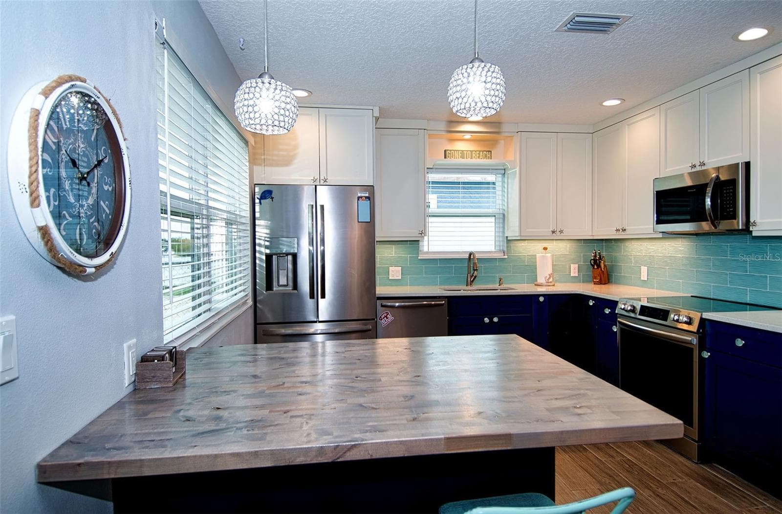 Food preparation in this amazing kitchen is a breeze with all its counter space and updated appliances. - 6420 BOATYARD DR, HUDSON