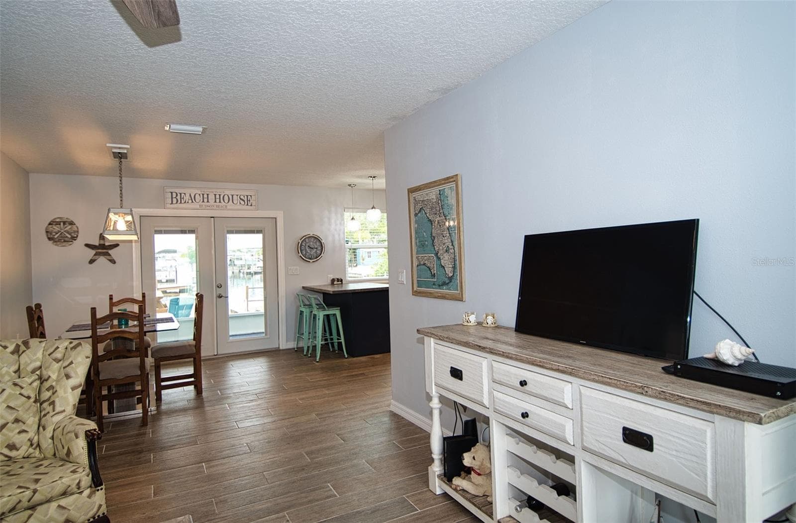 Open floor plan takes you from Living Room to Dining Room and striking kitchen. Beautiful glass French Doors. and - 6420 BOATYARD DR, HUDSON