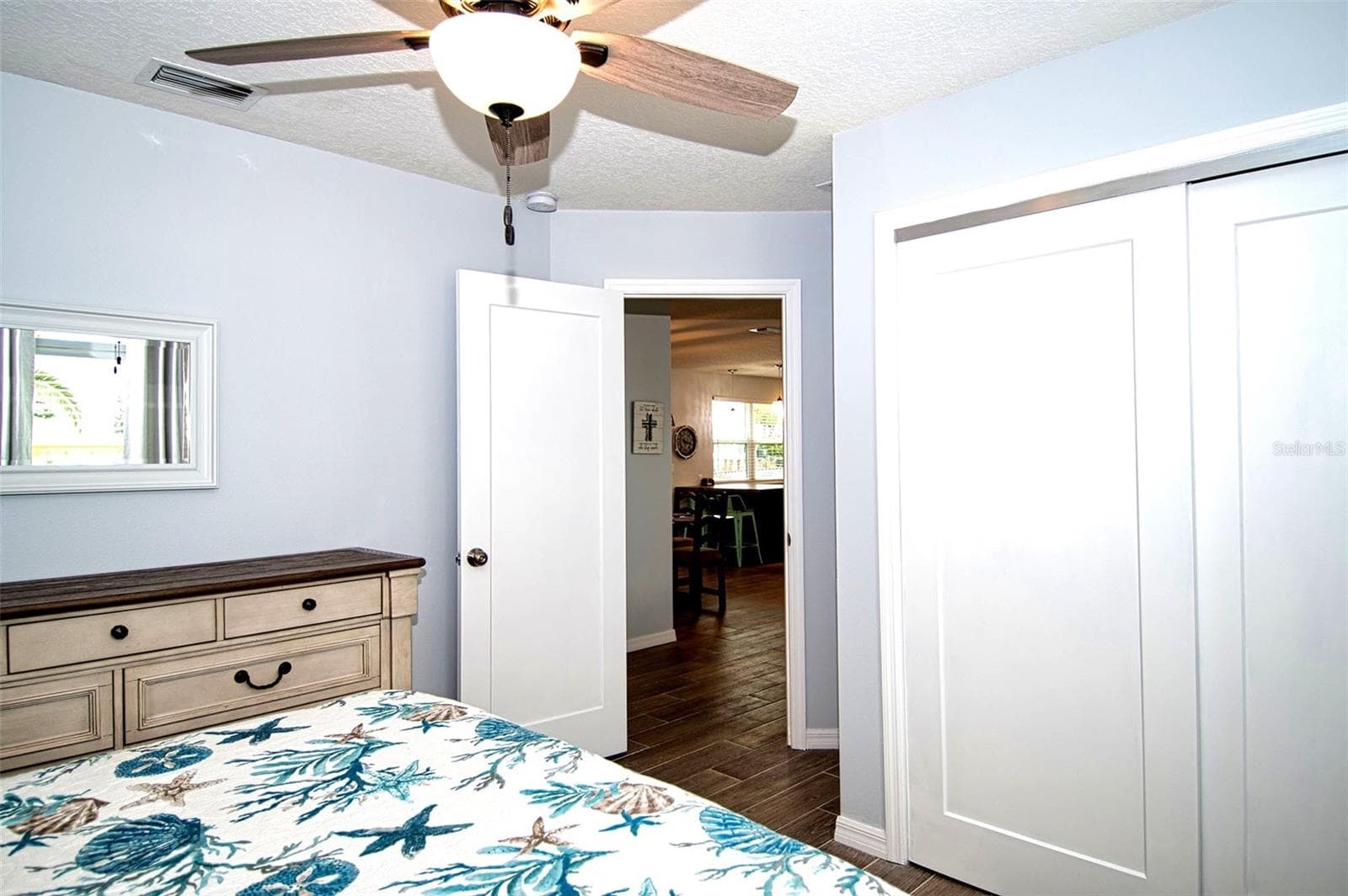 Guest bedroom has full wall of closet space. - 6420 BOATYARD DR, HUDSON