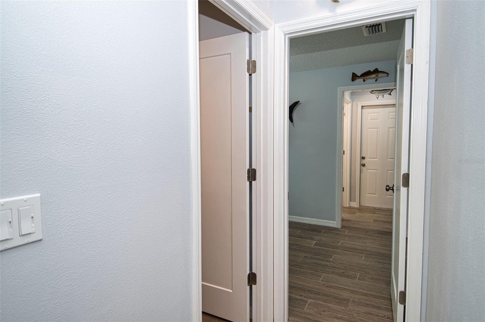 From Kitchen hallway leads to inside laundry room ~~ Office or Bonus Room ~~ to second full bathroom to Garage. - 6420 BOATYARD DR, HUDSON