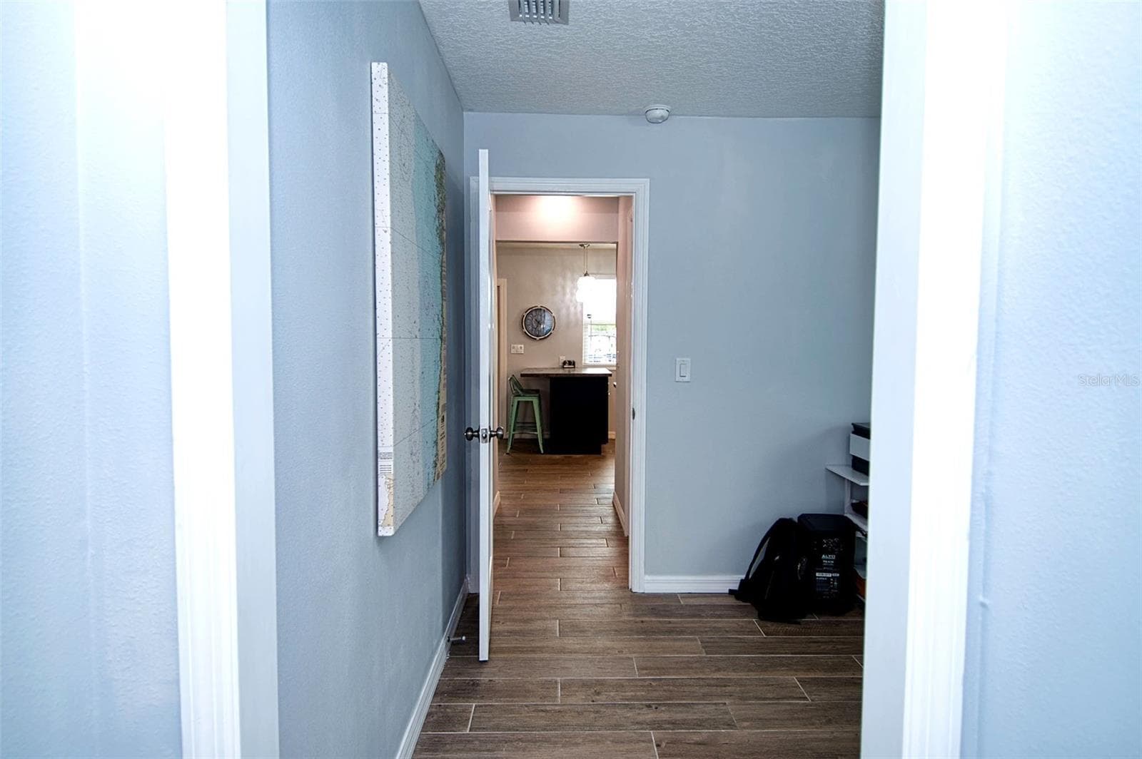 Looking from hallway to kitchen. - 6420 BOATYARD DR, HUDSON