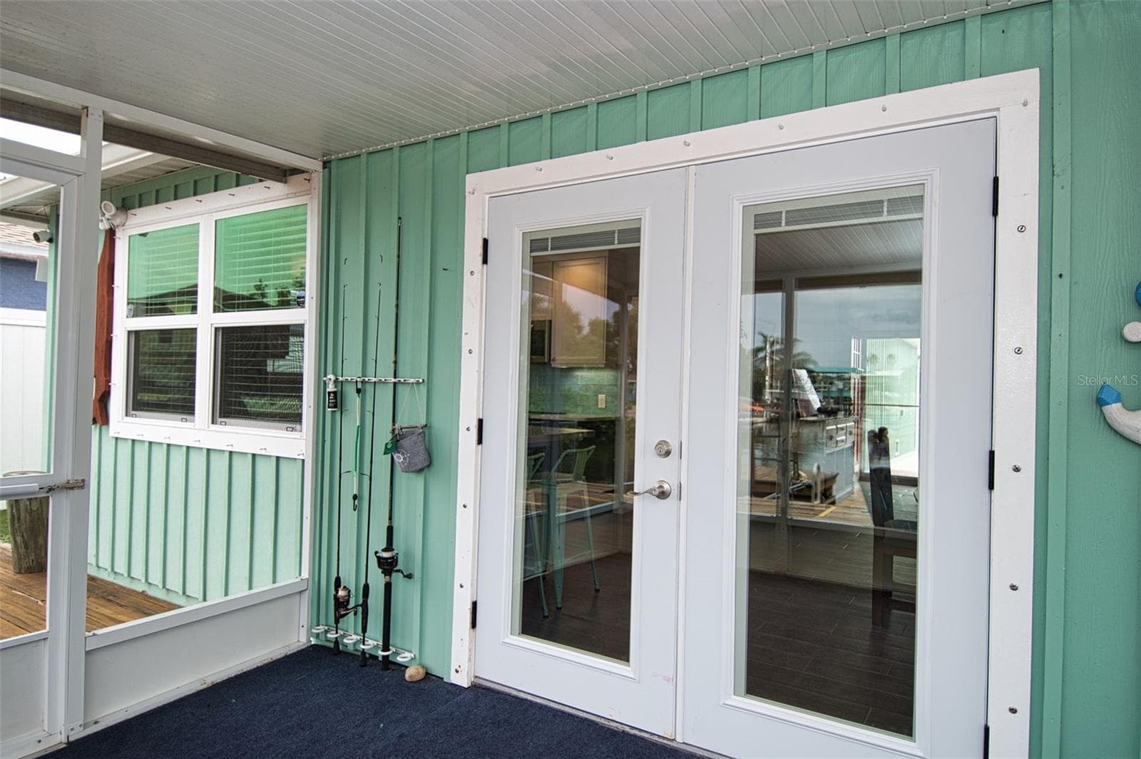 Spacious screen backyard porch is great spot for relaxing. - 6420 BOATYARD DR, HUDSON