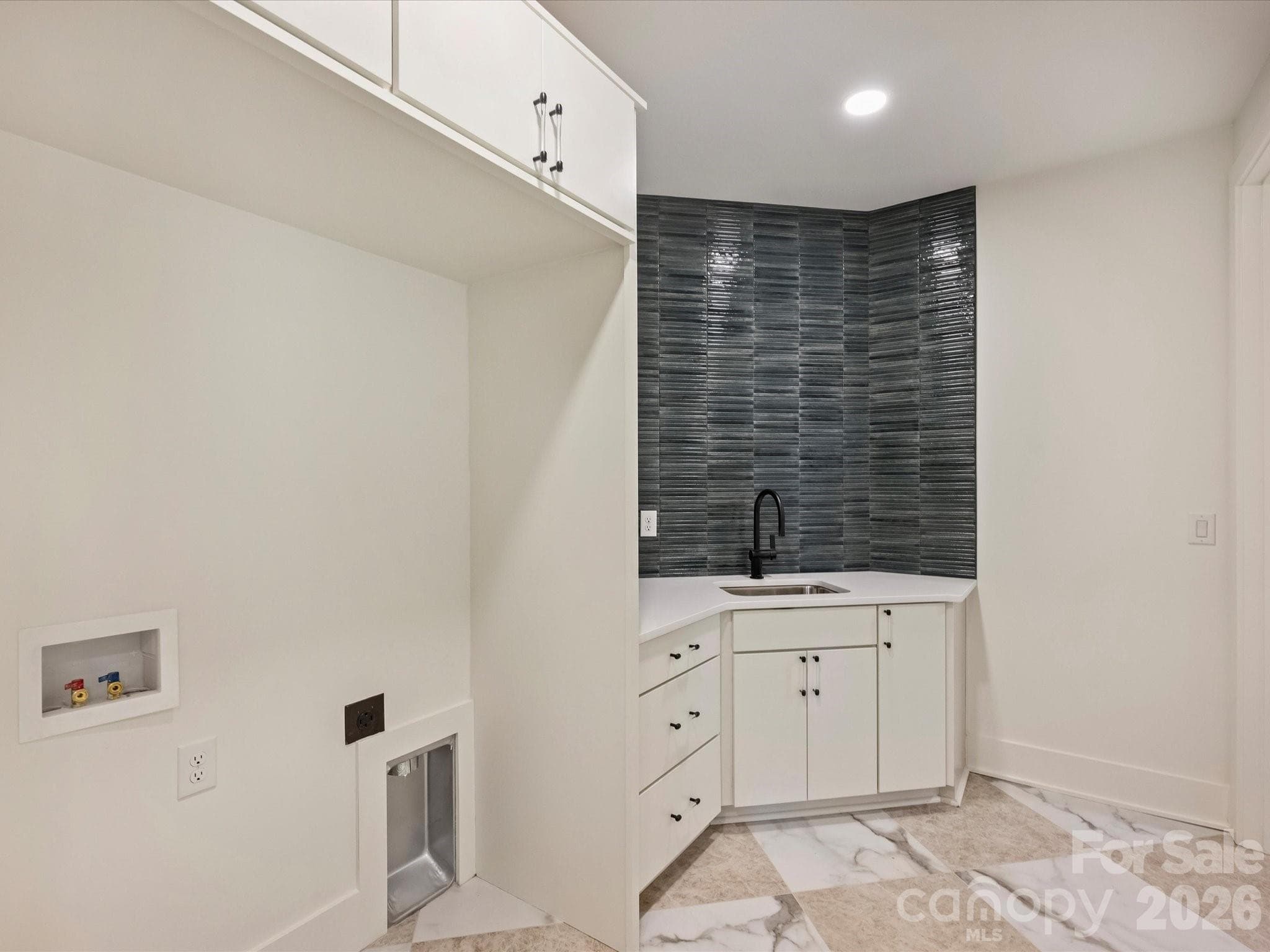 Large laundry room on the bedroom level. - 923 Laurel Creek Lane, Charlotte