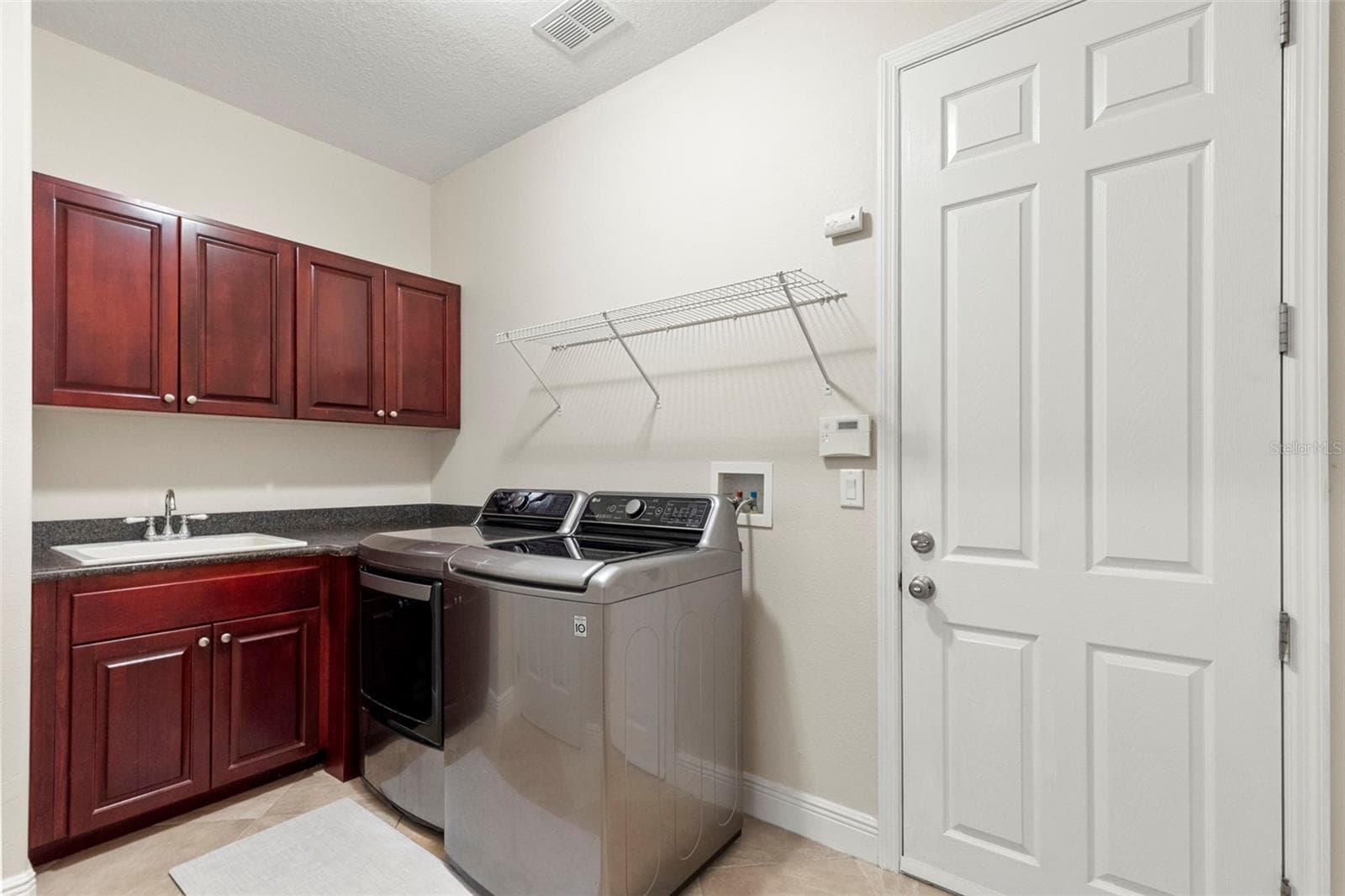 Laundry Room-Expansive Closet, Cabinet Space, Storage Shelves & Utility Sink - 20203 CANE RIVER WAY, TAMPA