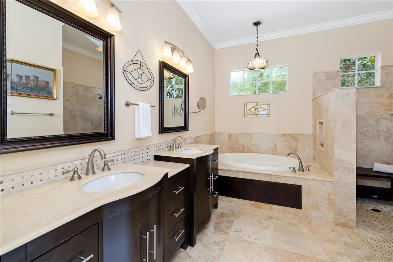 Primary owner resort style ensuite spa inspired bathroom, with marble flooring, stone backsplash, dual sinks, soaking garden tub, walk in shower - 12471 NATUREVIEW CIR, BRADENTON