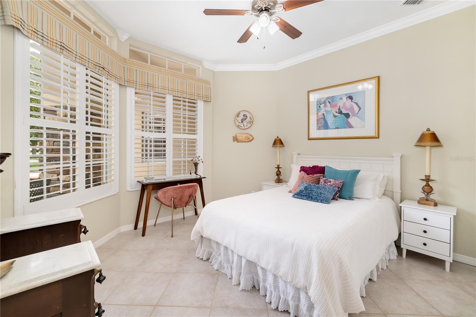 Bedroom suite 2 with closet, ceramic flooring, plantation shutters - 12471 NATUREVIEW CIR, BRADENTON