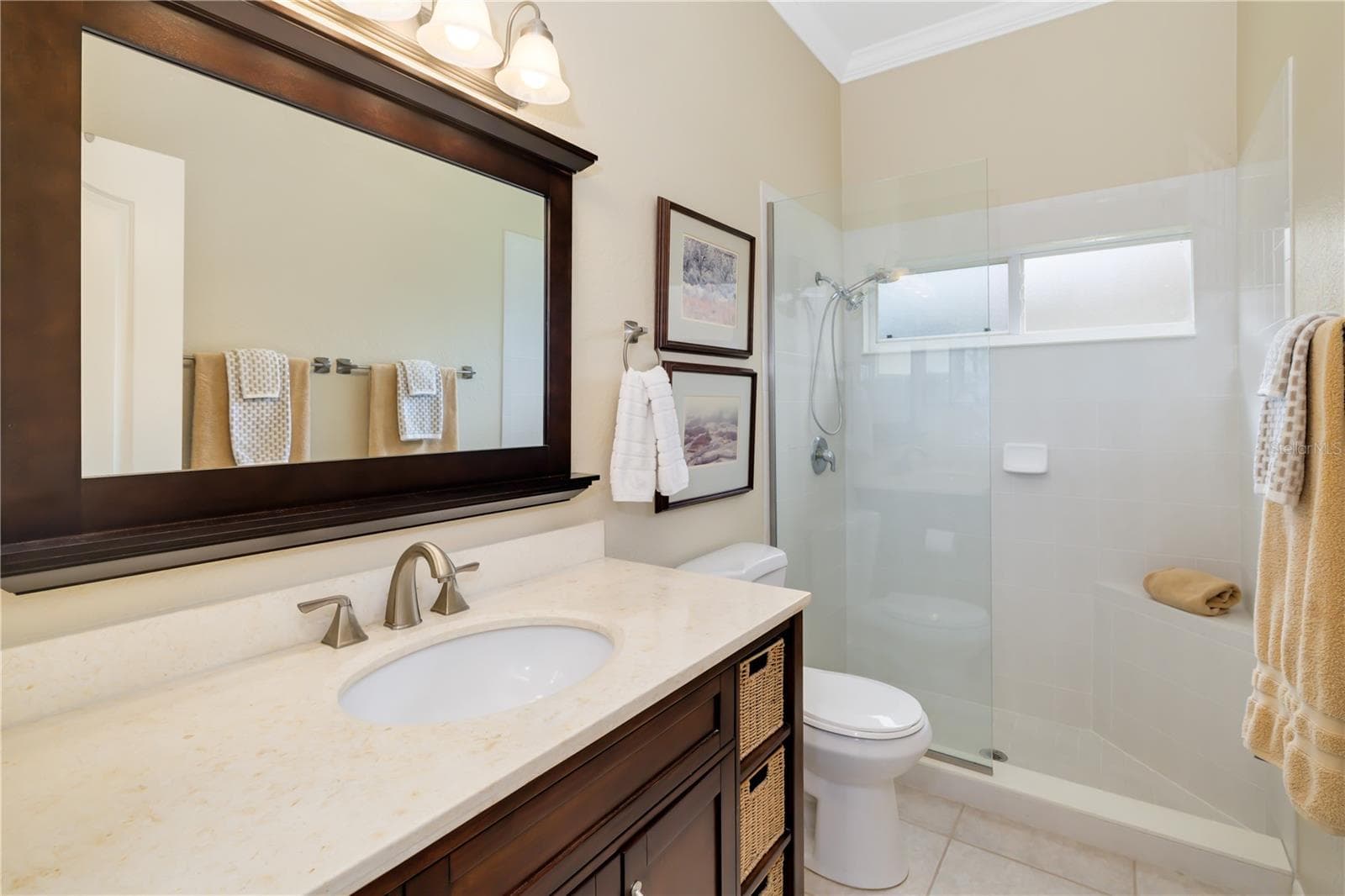 Bathroom 2, shared between bedroom 2, 3, 4 with stone countertops, walk in shower, linen closet - 12471 NATUREVIEW CIR, BRADENTON