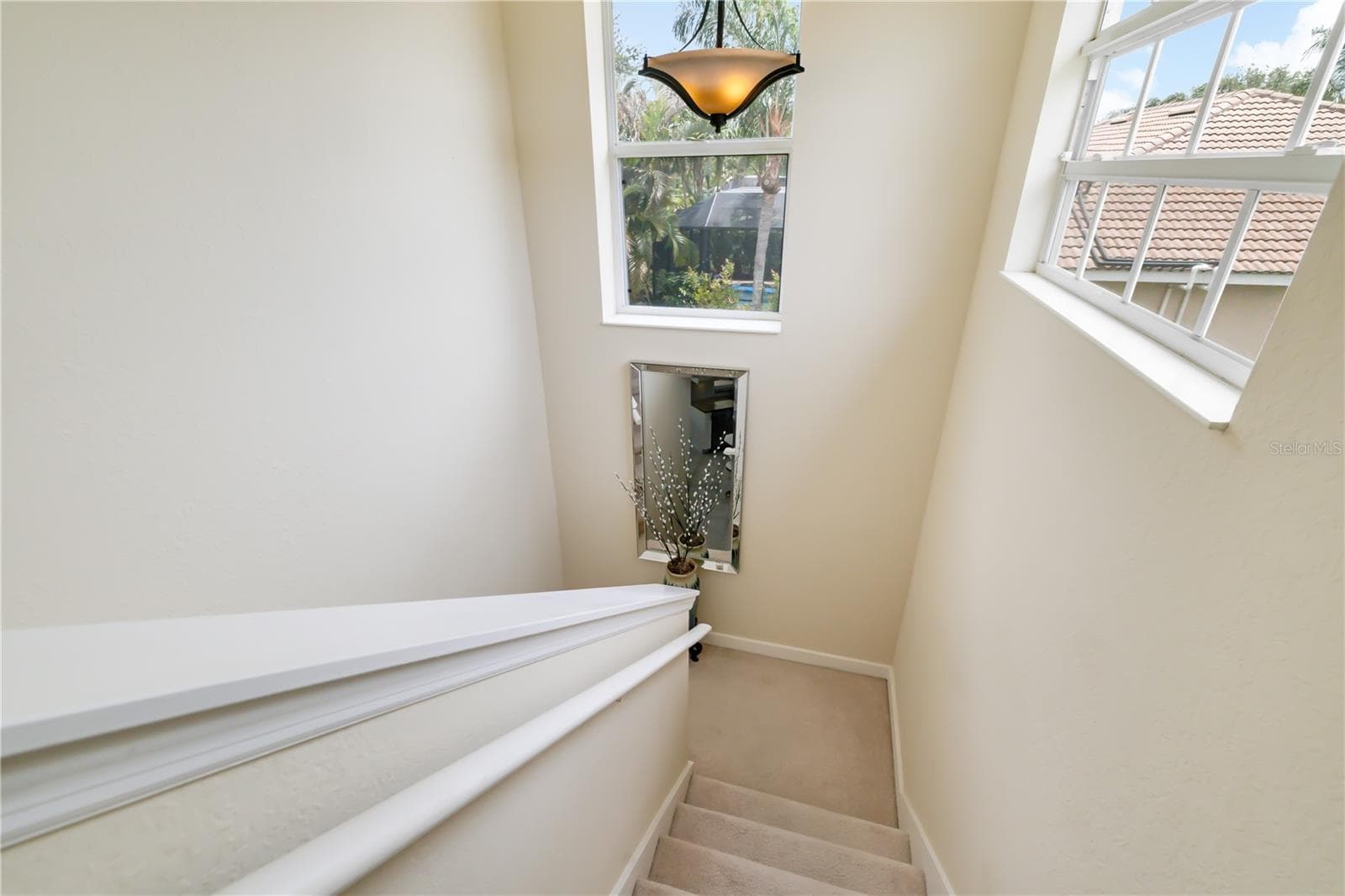 Stairwell leading up to the bedroom 5, loft, massive bedroom suite with full bathroom - 12471 NATUREVIEW CIR, BRADENTON