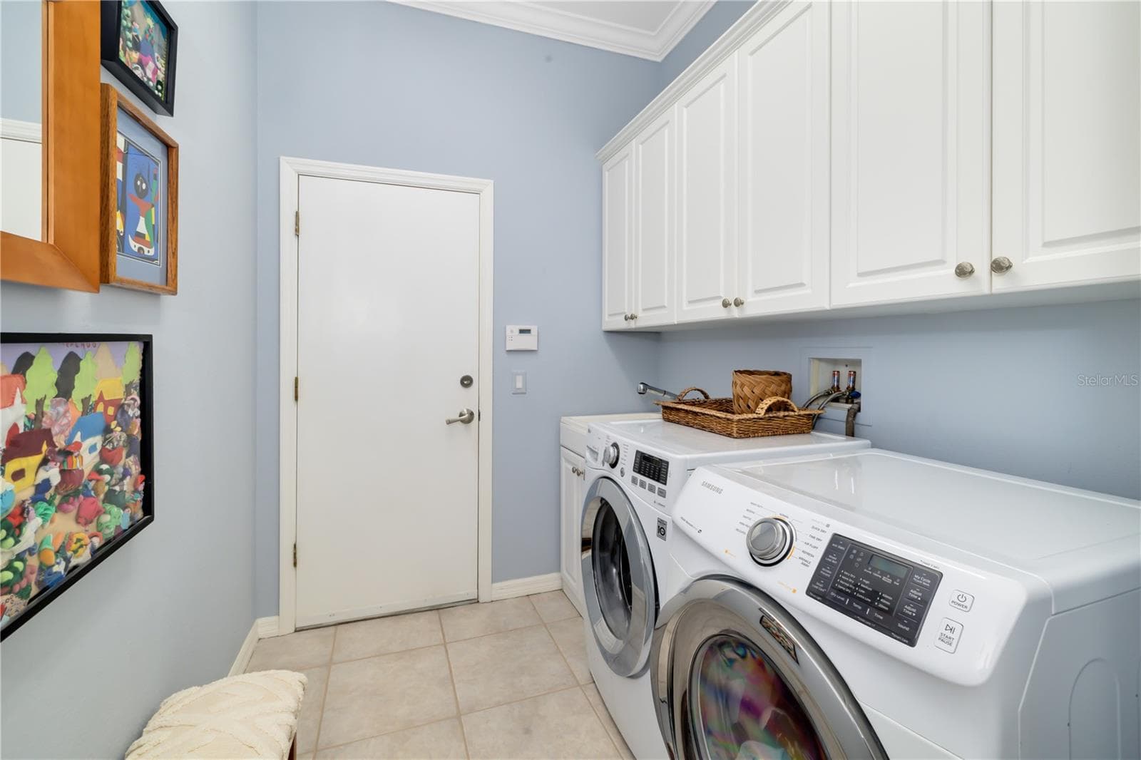 Interior Laundry room, utility sink, storage cabinets, linen closet - 12471 NATUREVIEW CIR, BRADENTON