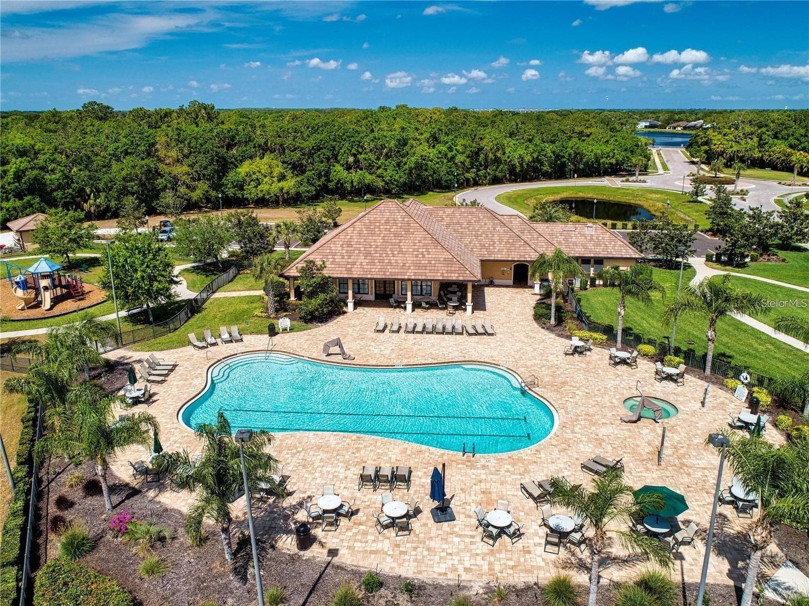 Community center, pool West, clubhouse, where all the social events are held, food trucks, happy hours, clubs, mahjong, bunco, library, kitchen and space to rent out for social events for residence - 12471 NATUREVIEW CIR, BRADENTON