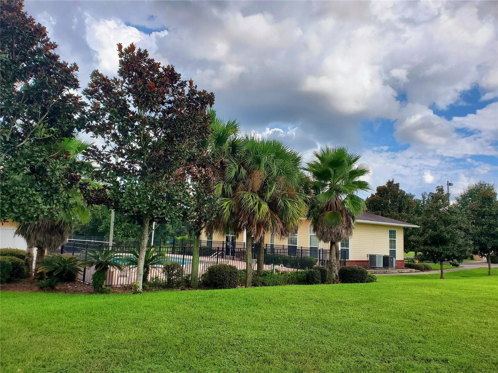 Community pool across the road from the unit - 1561 NW 29TH RD #8, GAINESVILLE
