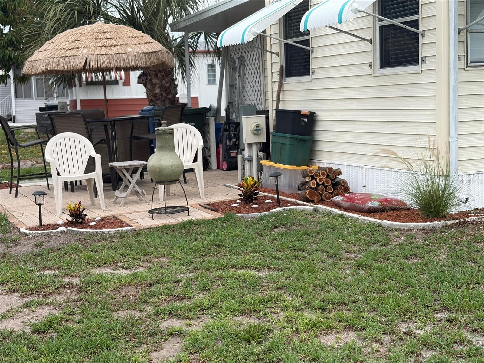 View of patio and the seating area around the stove. - 723 ROMA RD, VENICE