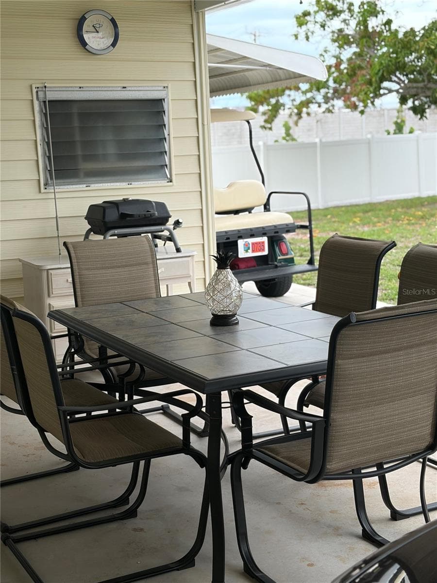 Double carport also works for a covered patio with dining table. - 723 ROMA RD, VENICE