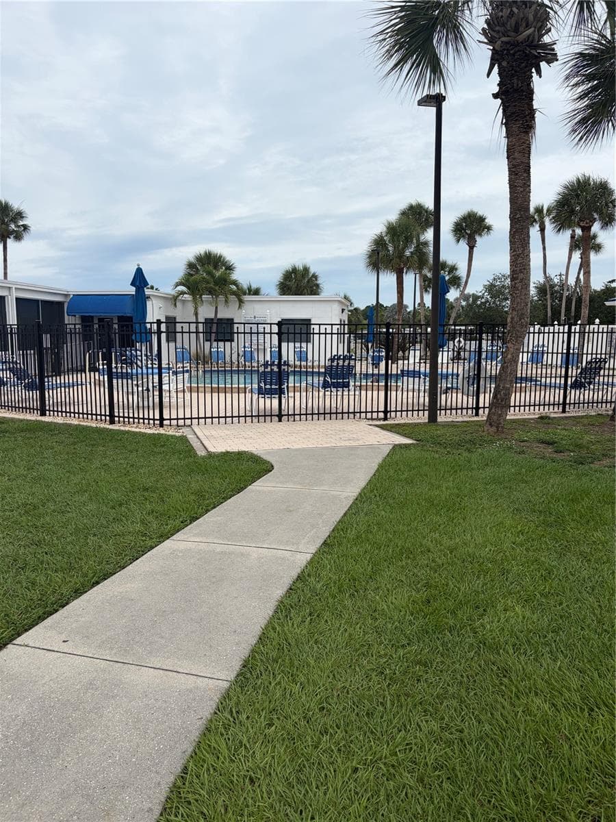 Sidewalk to the large pool - this is only one of the two pools on the property. - 723 ROMA RD, VENICE