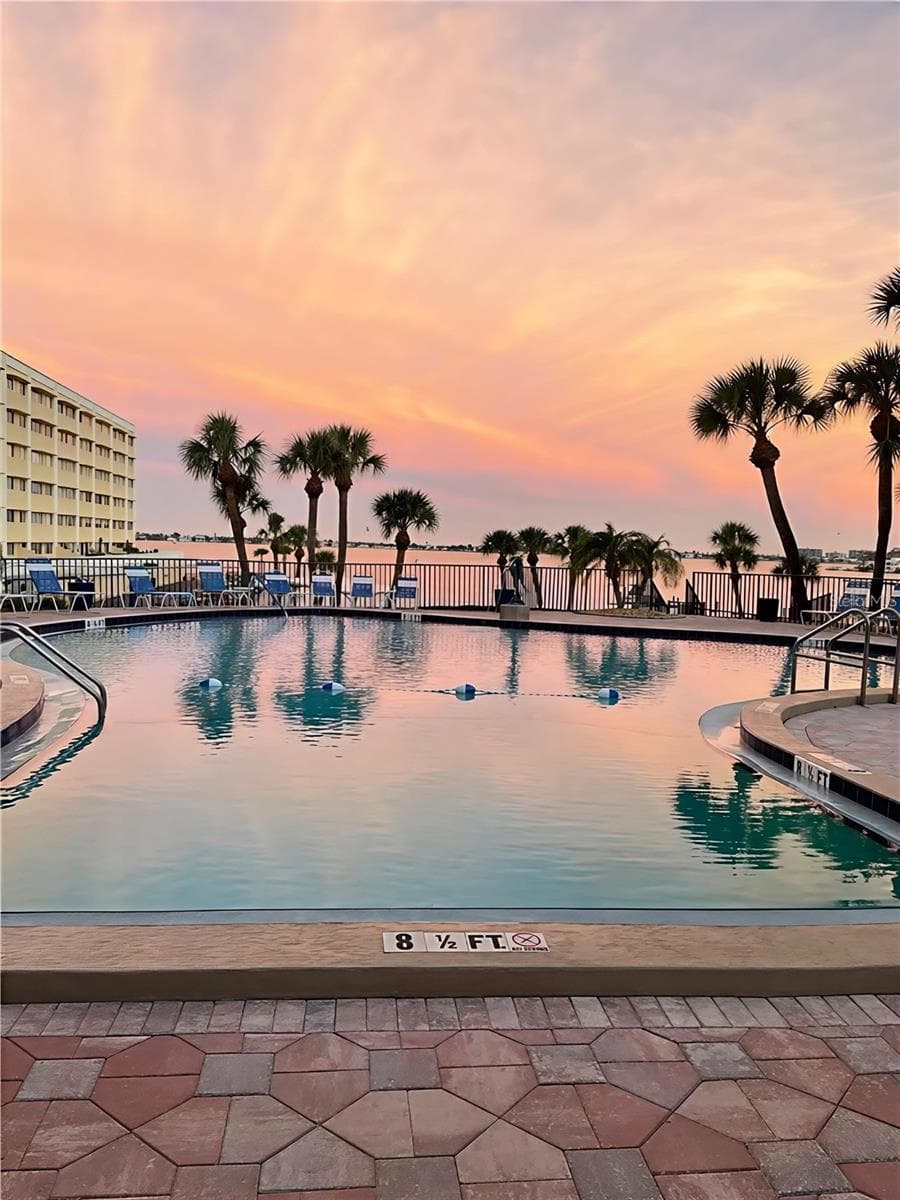 Sunrise at pool - 100 BLUFF VIEW DR #608C, BELLEAIR BLUFFS