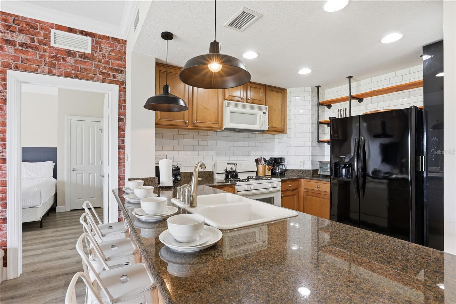 Updated silverware and a cozy seating area for morning coffee. - 7673 HERITAGE CROSSING WAY #102, REUNION