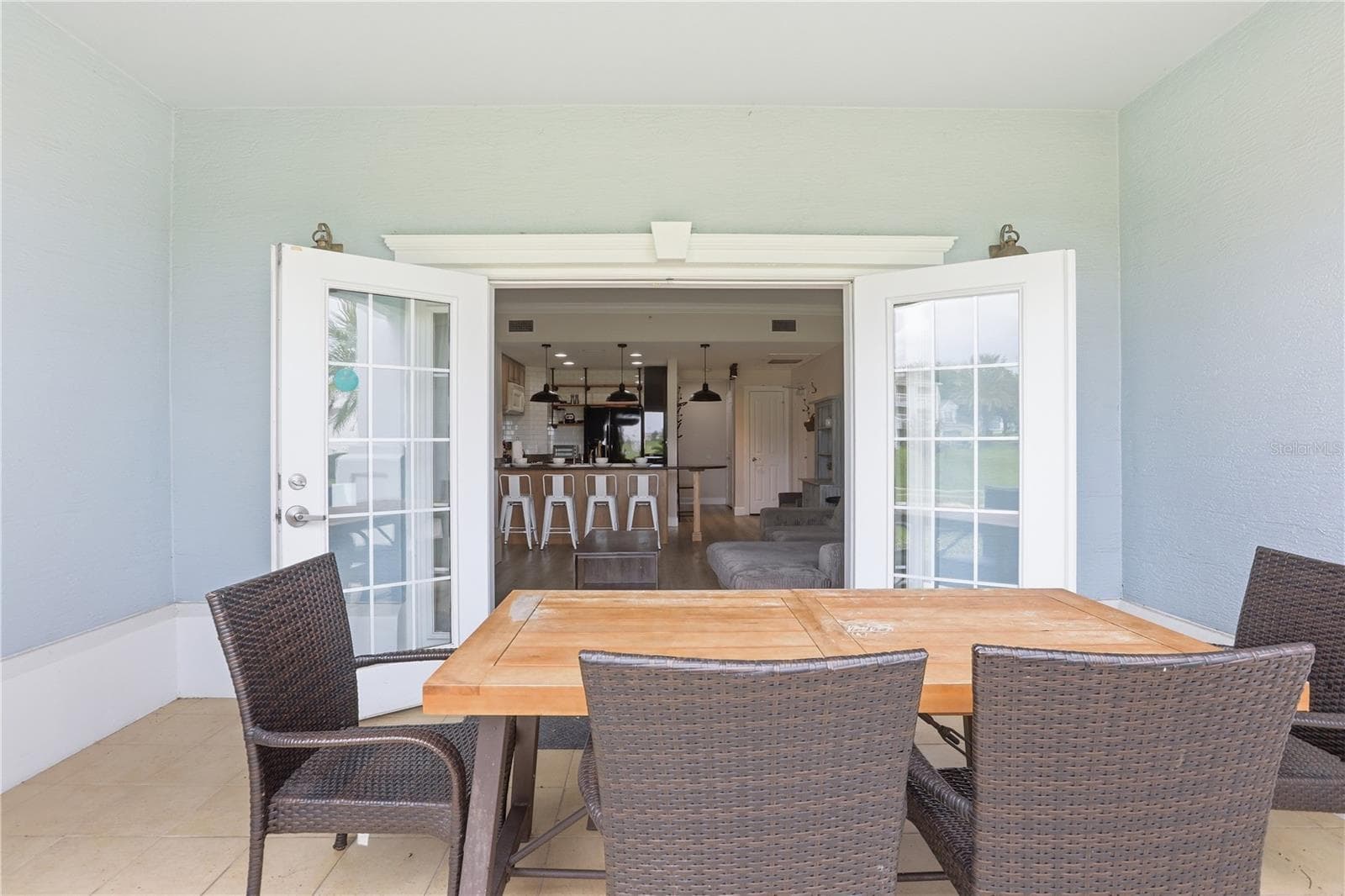 Private balcony with comfortable seating for breakfast or dining while enjoying beautiful golf course views. - 7673 HERITAGE CROSSING WAY #102, REUNION