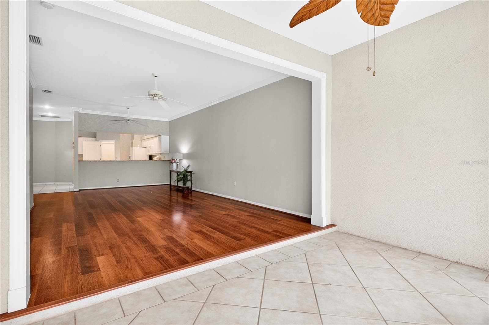 Opposite side with bar open to kitchen from dining room - 6948 STONEYWALK CT, BRADENTON