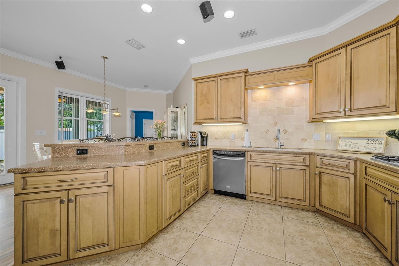 Plenty of power hook ups! Under cabinet lighting. Dishwasher. Trash Drawer under cabinet. - 1888 BUGLE LN, CLEARWATER
