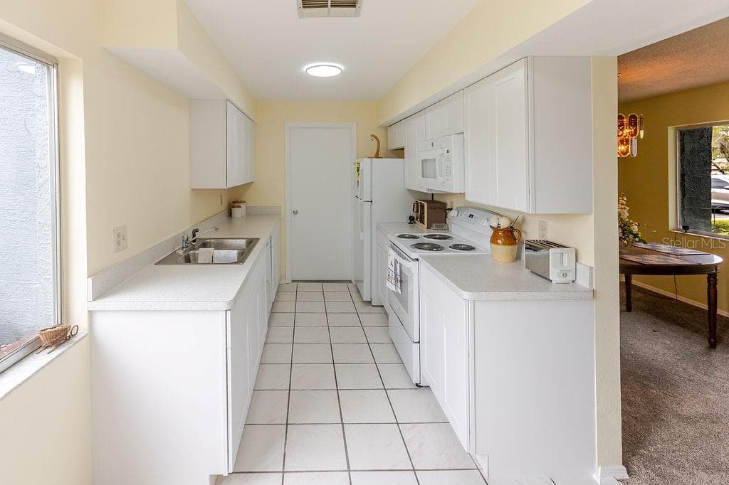Galley kitchen - 7560 ST ANDREWS BLVD #7560, WEEKI WACHEE