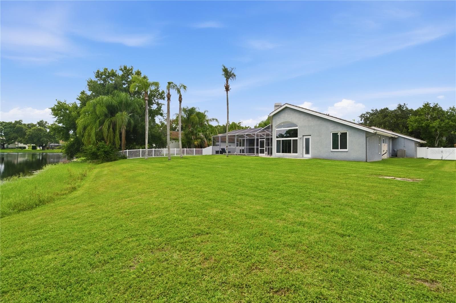 View from your privacy wall enclosing the rear of your property around the pond - 17024 WINNERS CIR, ODESSA