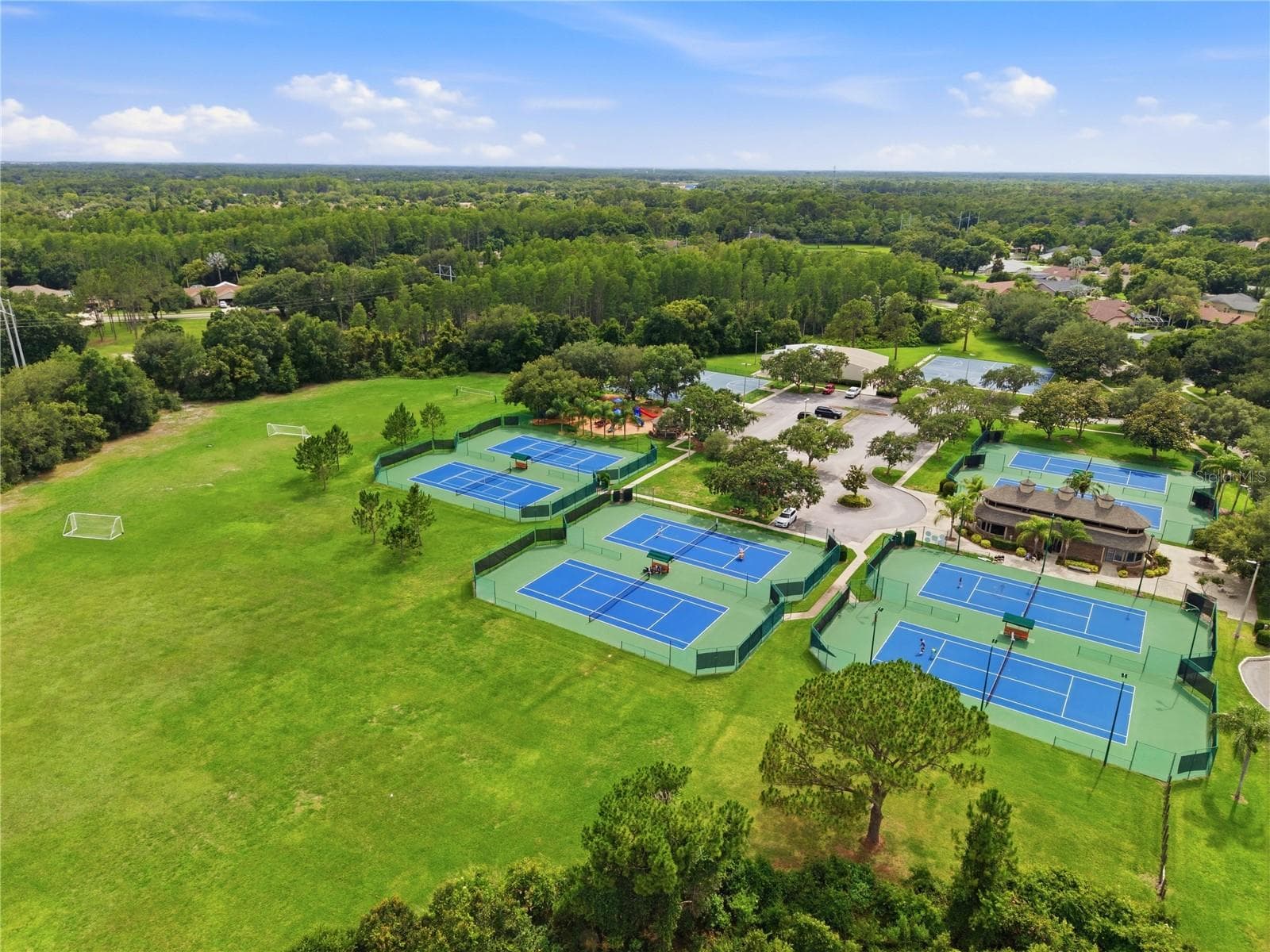 Aerial view of the Van Dyke Farms amenities around the Clubhouse. Tennis, Racquetball, Basketball, Hockey, Soccer & a Baseball Diamond. - 17024 WINNERS CIR, ODESSA