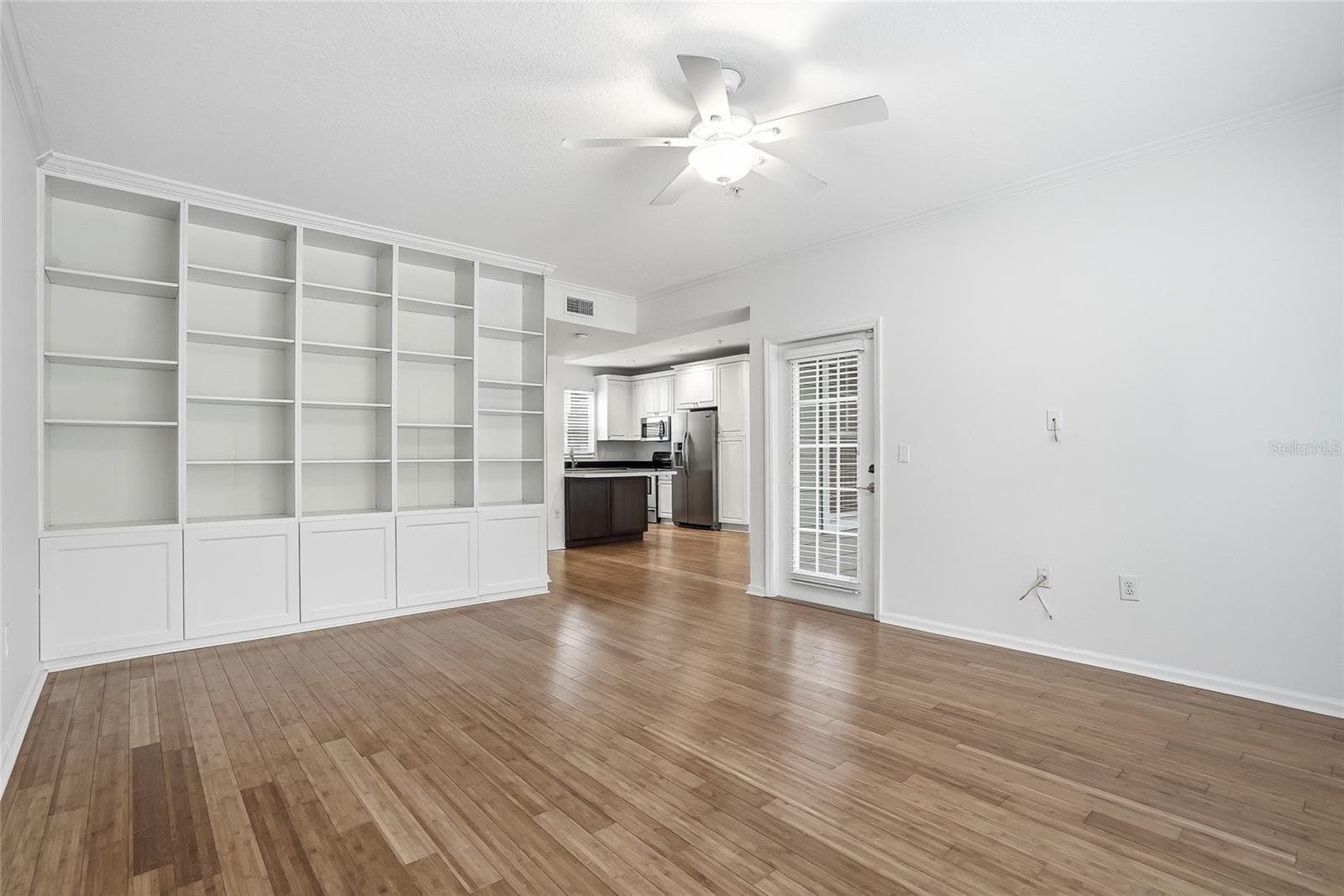 Living Space with a Custom Built in Shelf, Door Leads to one of 2 balcony's - 809 S OREGON AVE #B, TAMPA