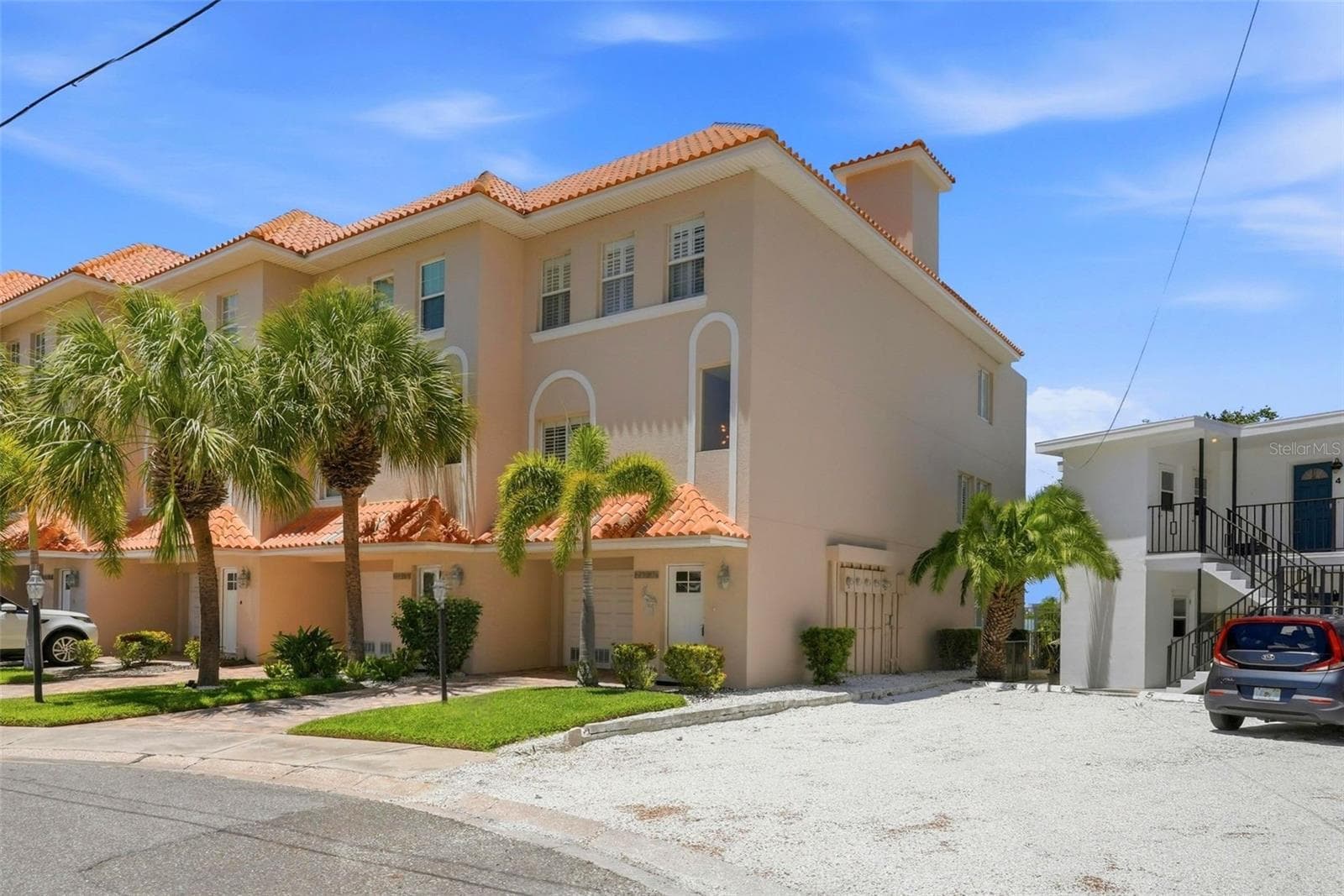 Welcome to this exceptional waterfront corner-unit townhome, offering 3B/3B - three levels with sweeping water views from every floor. It features an elevator, an assigned 30ft deepwater boat slip with a 10,000-pound lift, a rooftop terrace, climate-controlled bonus room on ground level, and a low monthly maintenance fee of $592. - 200 BRIGHTWATER DR #10, CLEARWATER BEACH