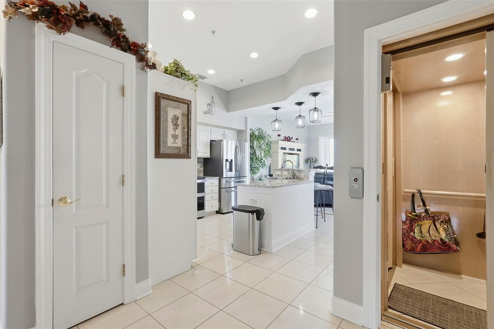 2nd level features high ceilings, a kitchen with an oversized quartz island opening into spacious waterfront living area with balcony and wide water views! - 200 BRIGHTWATER DR #10, CLEARWATER BEACH