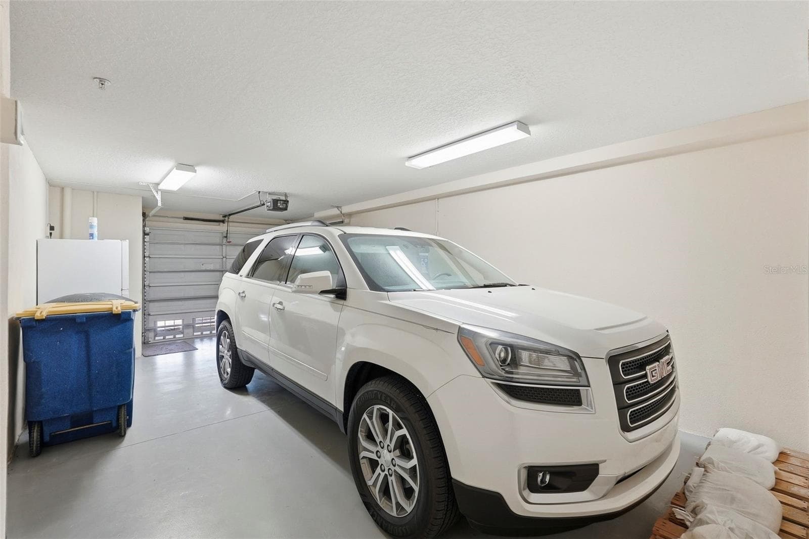 Spacious garage, currently one car as the current owners put up a partition wall for storage (next pic) which can easily be taken down to convert back to a 2 car tandem garage. - 200 BRIGHTWATER DR #10, CLEARWATER BEACH