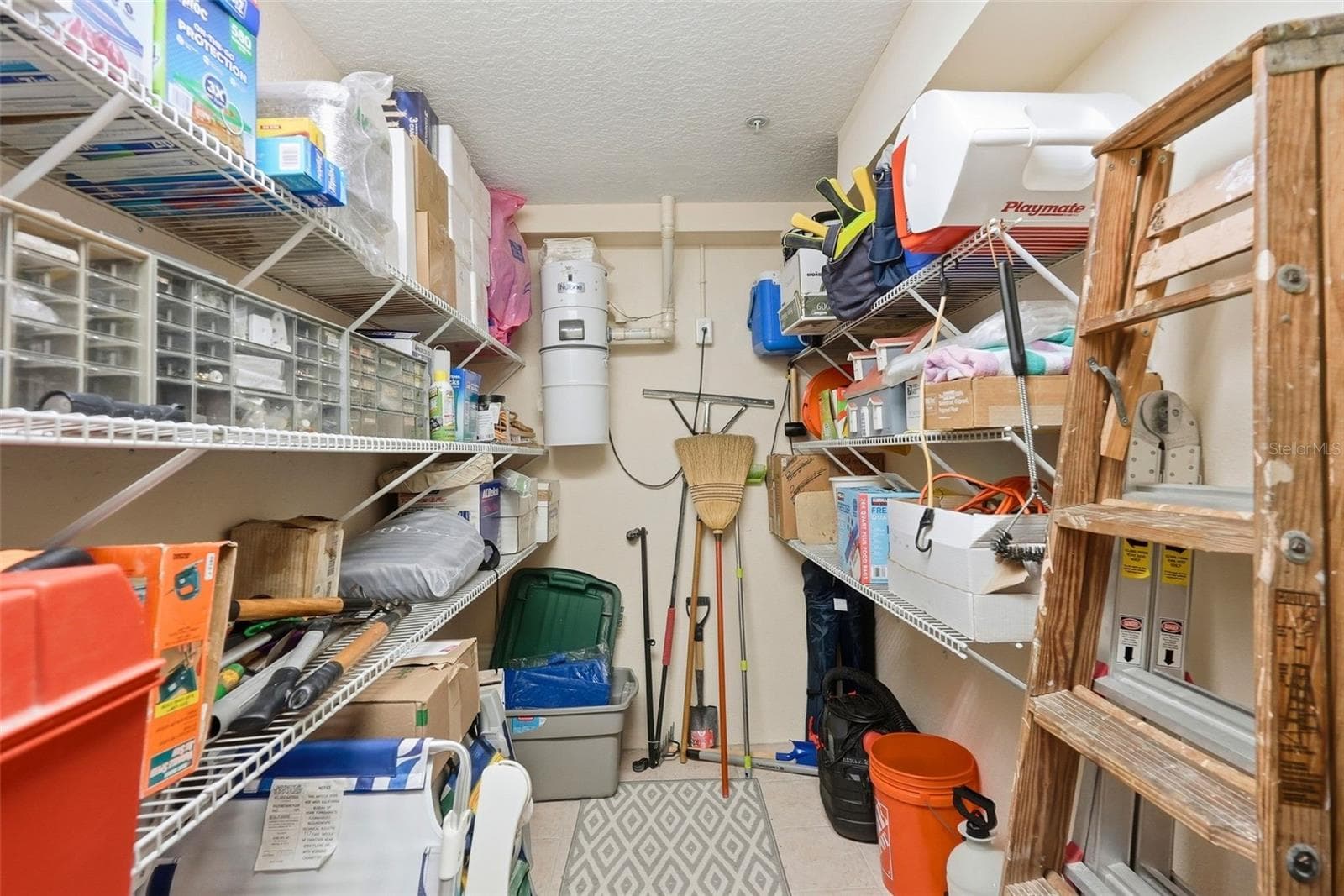 This is the extra storage room the owners made by putting up a wall in the garage. The wall can be removed to convert back to a 2 car tandem garage. - 200 BRIGHTWATER DR #10, CLEARWATER BEACH