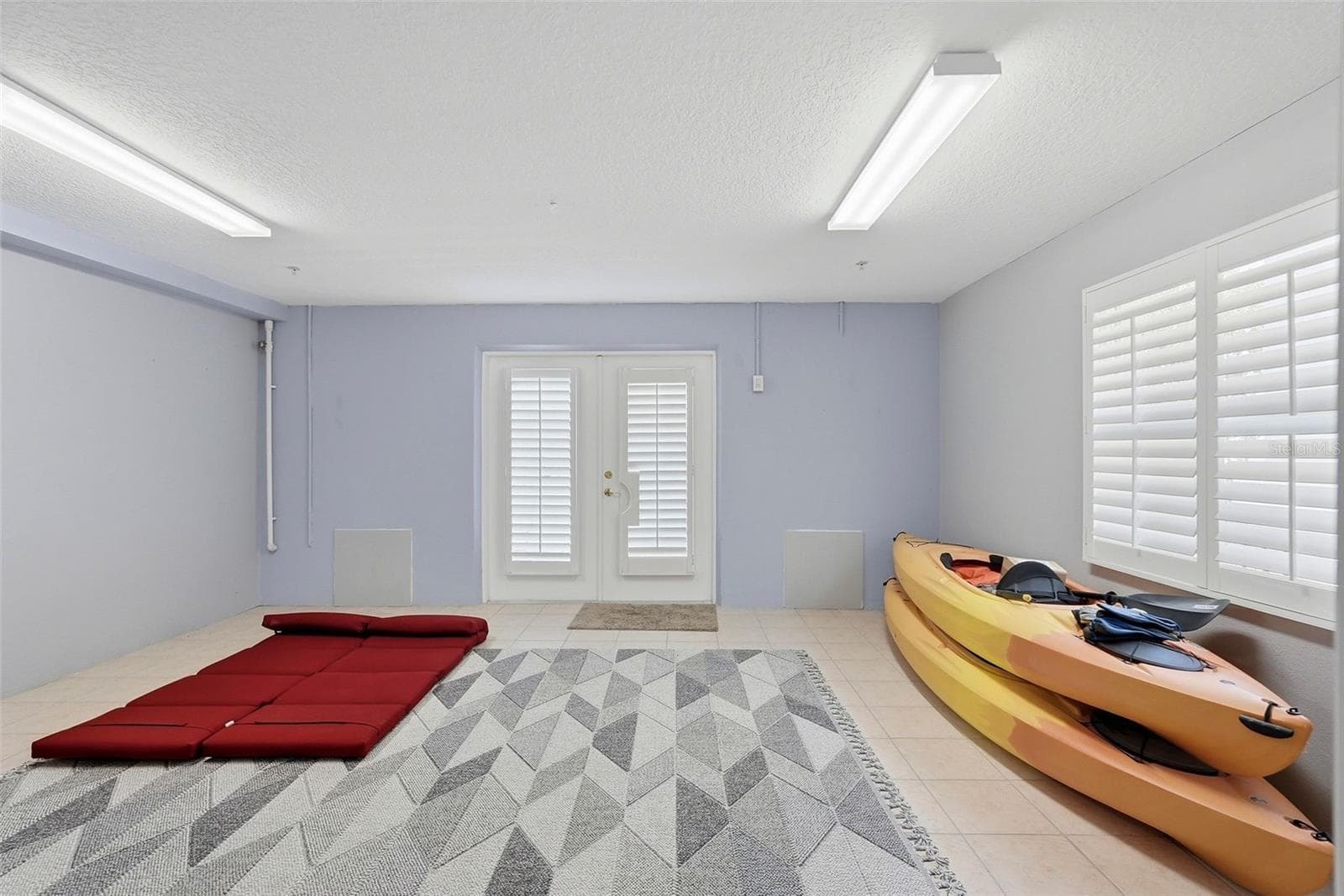 Climate-controlled bonus room on ground level leads to back patio! - 200 BRIGHTWATER DR #10, CLEARWATER BEACH