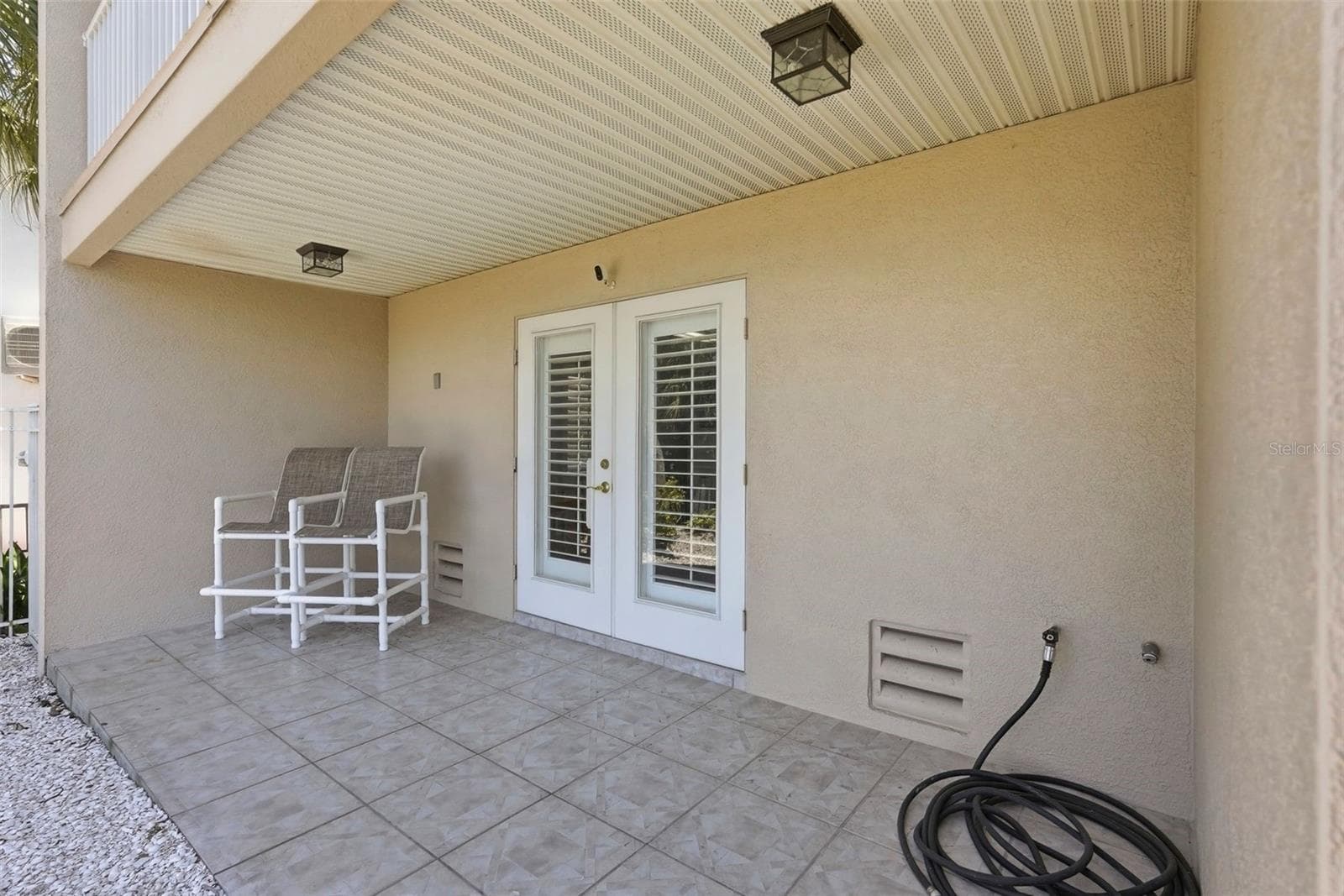 Ground level back patio. - 200 BRIGHTWATER DR #10, CLEARWATER BEACH