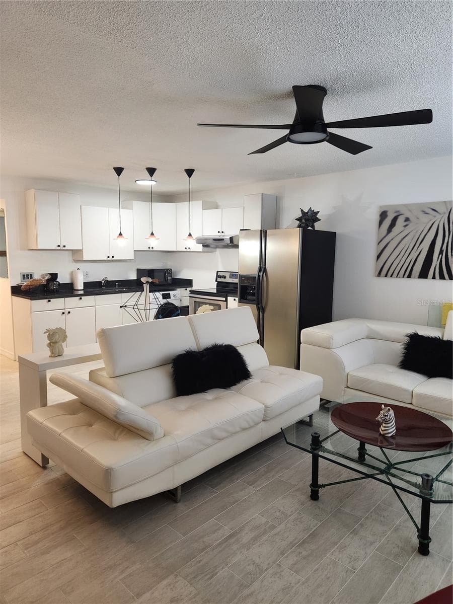 Open concept Living room, dining & kitchen - 9101 W HILLSBOROUGH AVE #I209, TAMPA