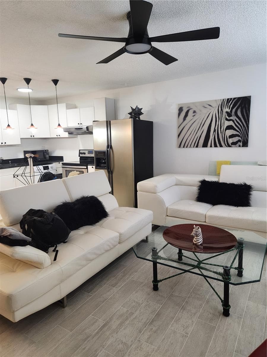 Open conept with newer fixtures & tile floors throughout - 9101 W HILLSBOROUGH AVE #I209, TAMPA