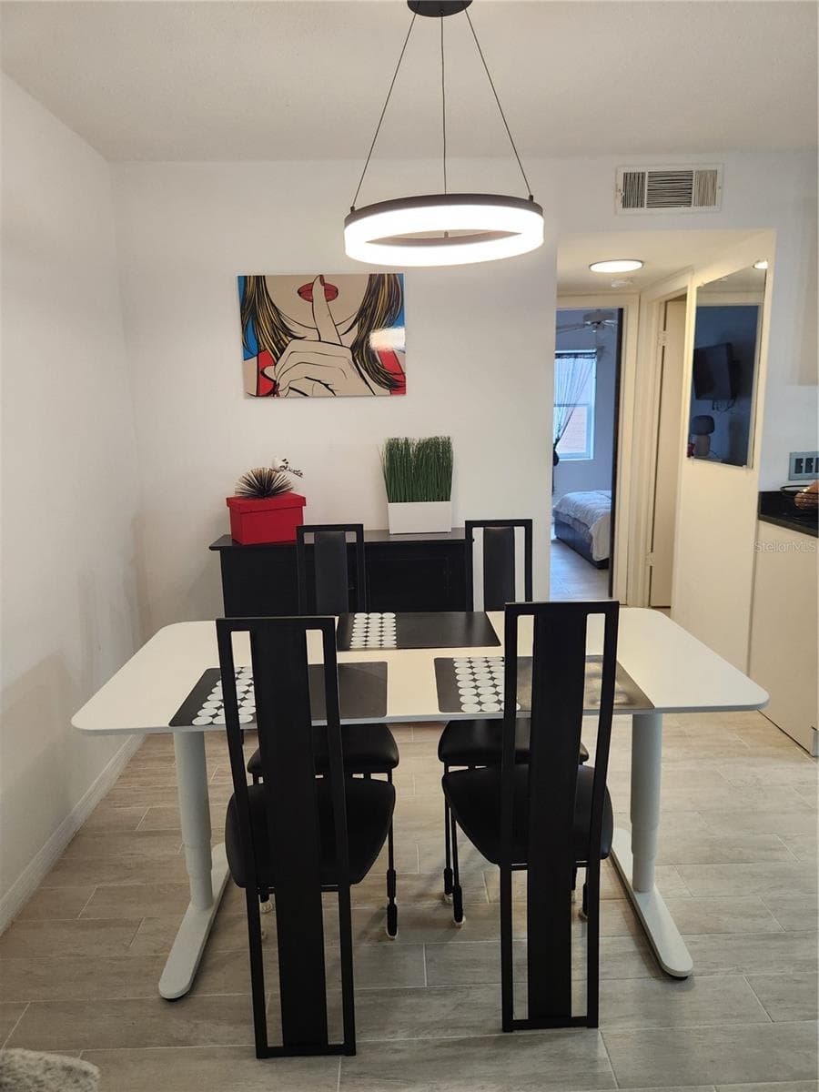 OPen concept dining area with room for dining table. - 9101 W HILLSBOROUGH AVE #I209, TAMPA