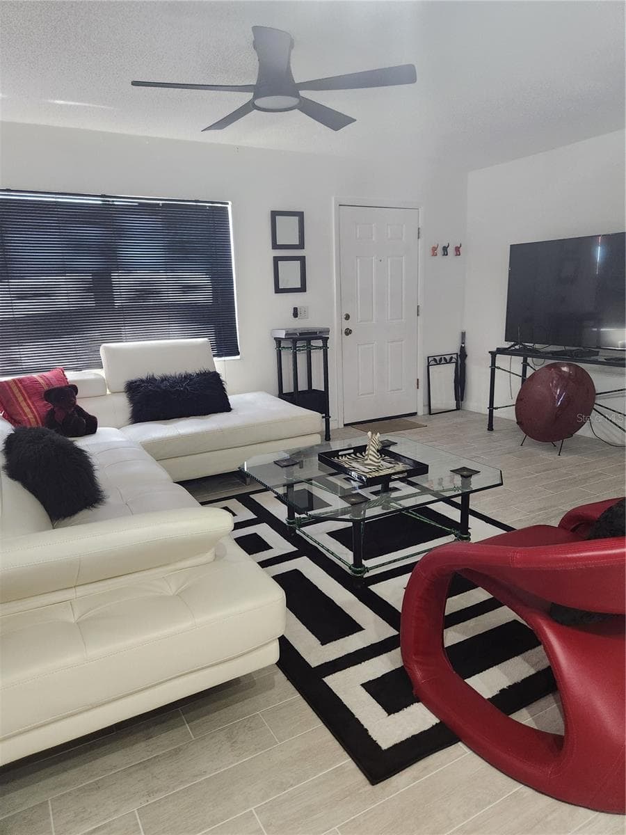 Open concept living, dining & kitchen with new tile floors throughout - 9101 W HILLSBOROUGH AVE #I209, TAMPA