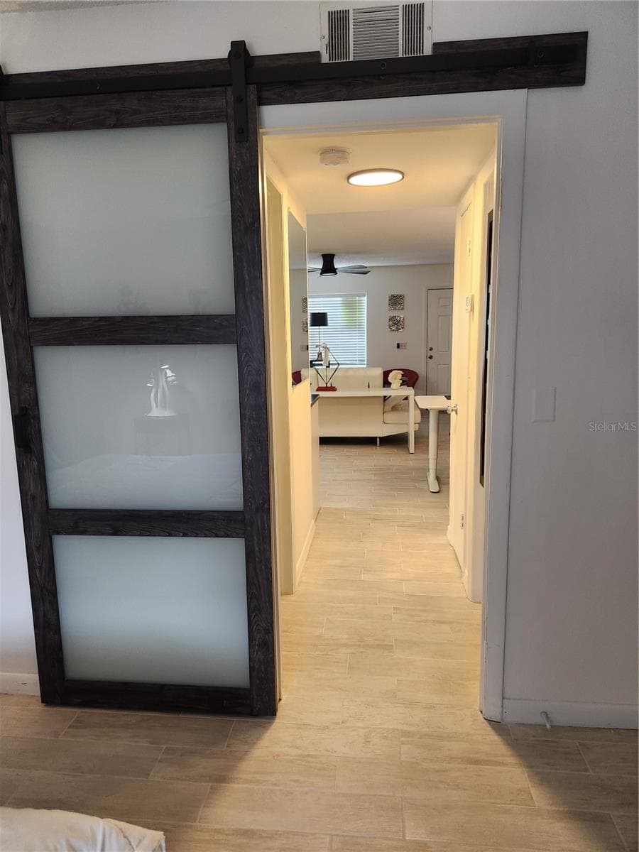 Bedroom barn door - 9101 W HILLSBOROUGH AVE #I209, TAMPA