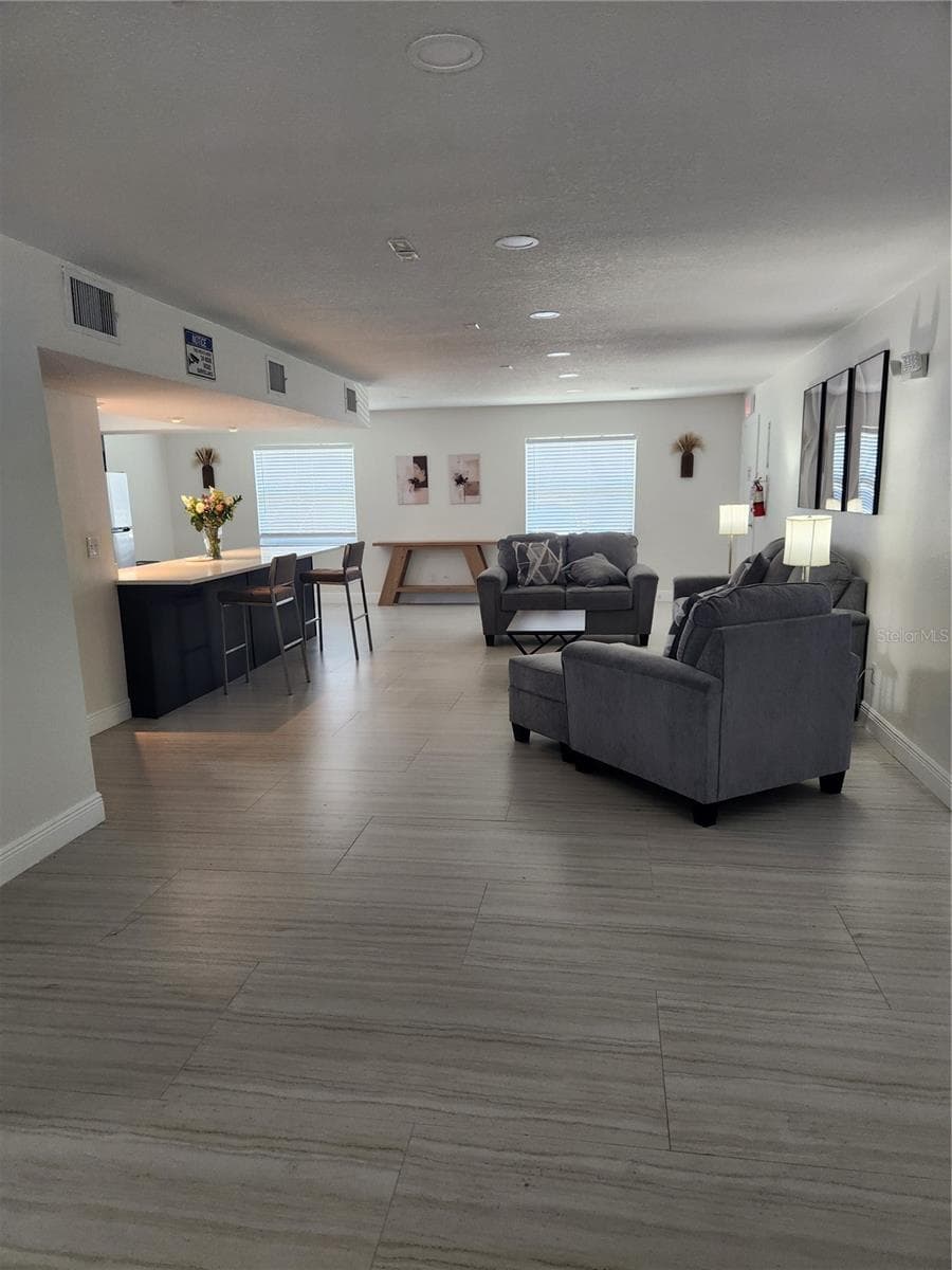 Clubhouse living room & kitchen - 9101 W HILLSBOROUGH AVE #I209, TAMPA