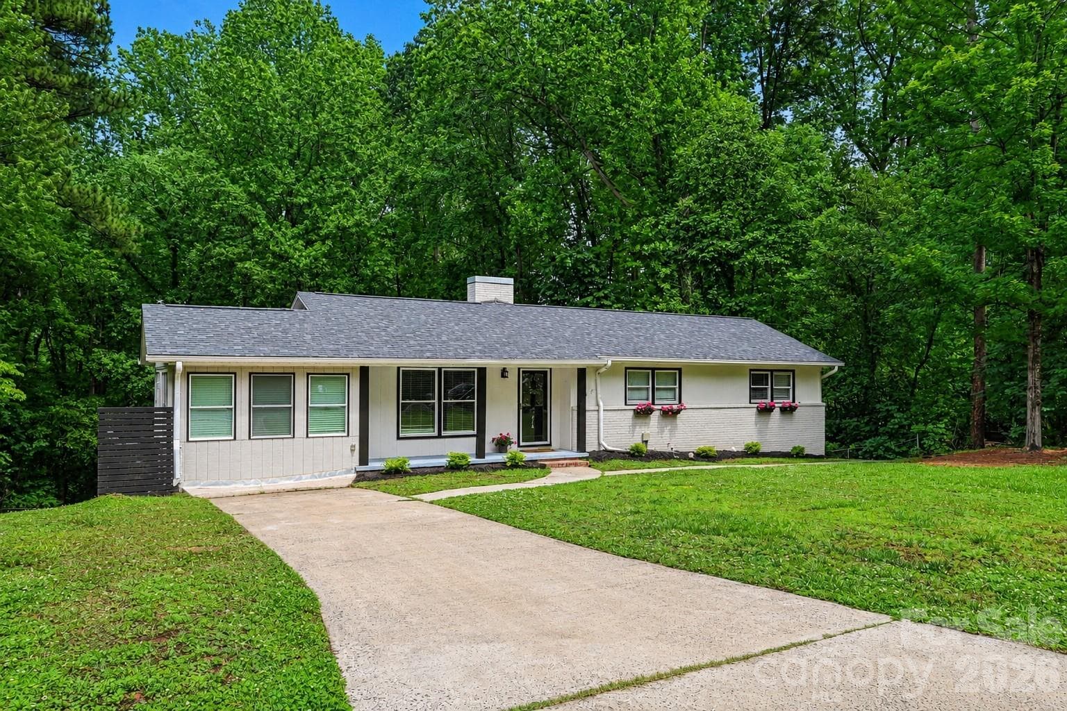 Fresh landscaping, mature trees, and a peaceful setting create a beautiful first impression. - Concord