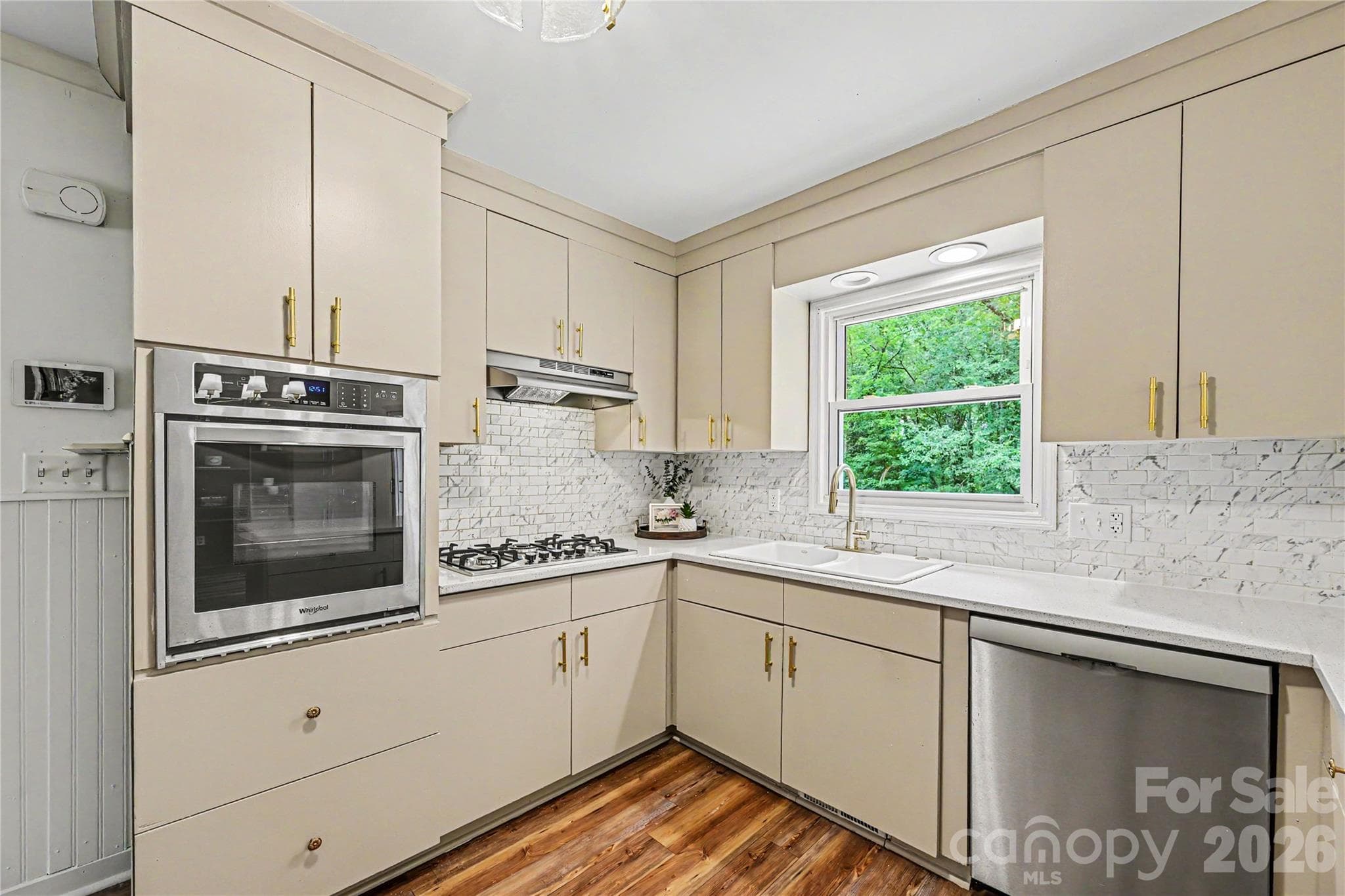 Thoughtfully updated kitchen with generous prep space, ample storage, and views of the private backyard. - Concord