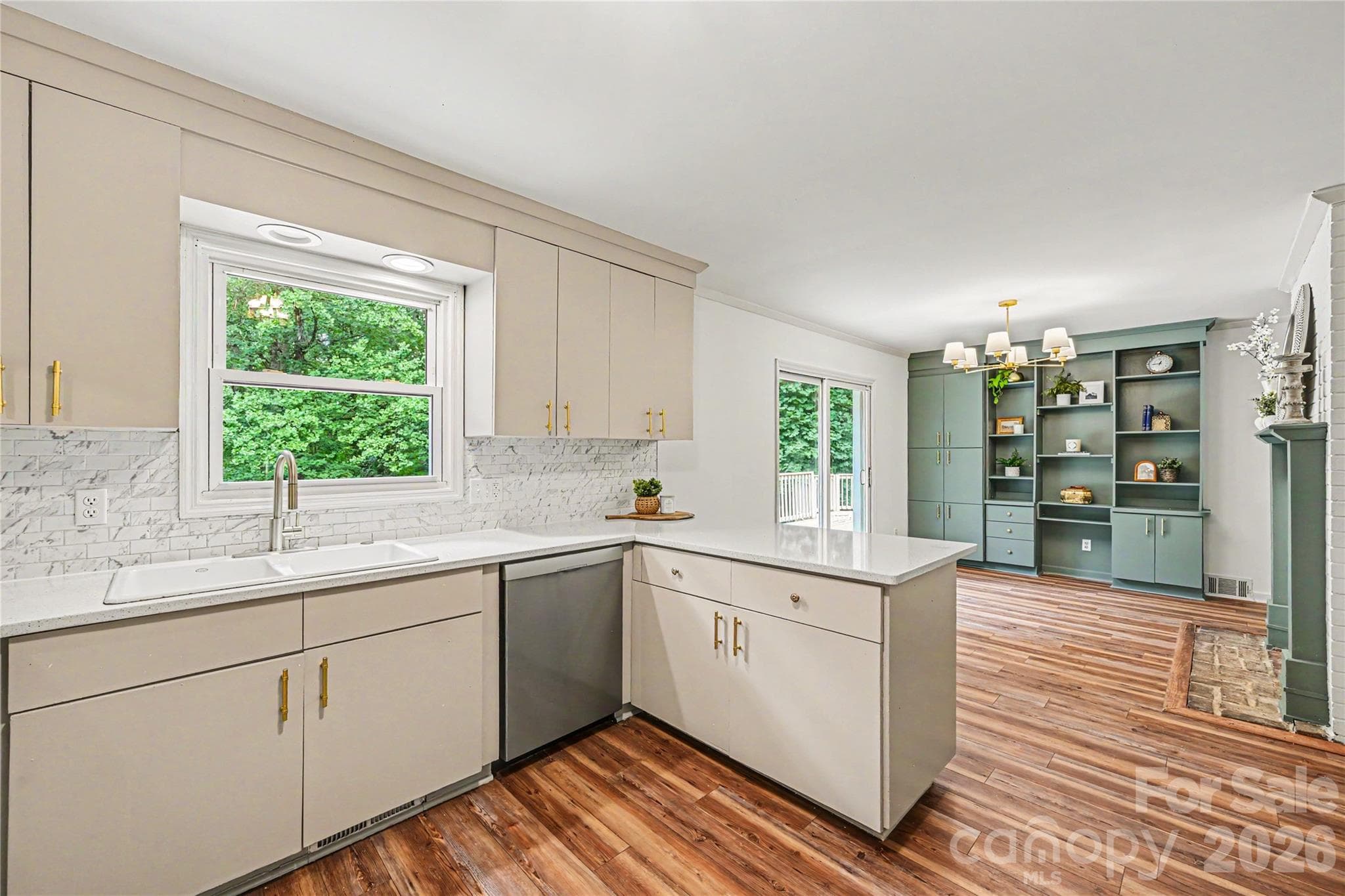 Open concept kitchen and dining area with direct access to the oversized deck, perfect for everyday living and entertaining. - Concord