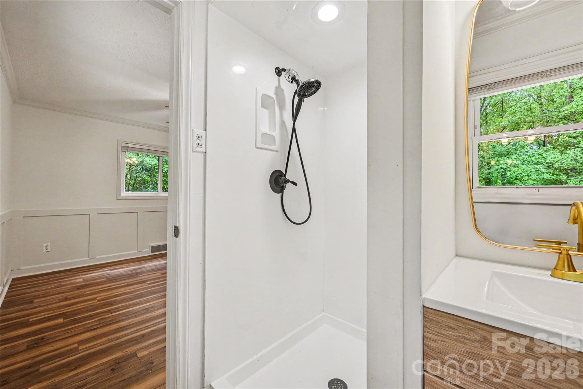 Updated primary bath featuring a walk in shower and modern fixtures. - Concord