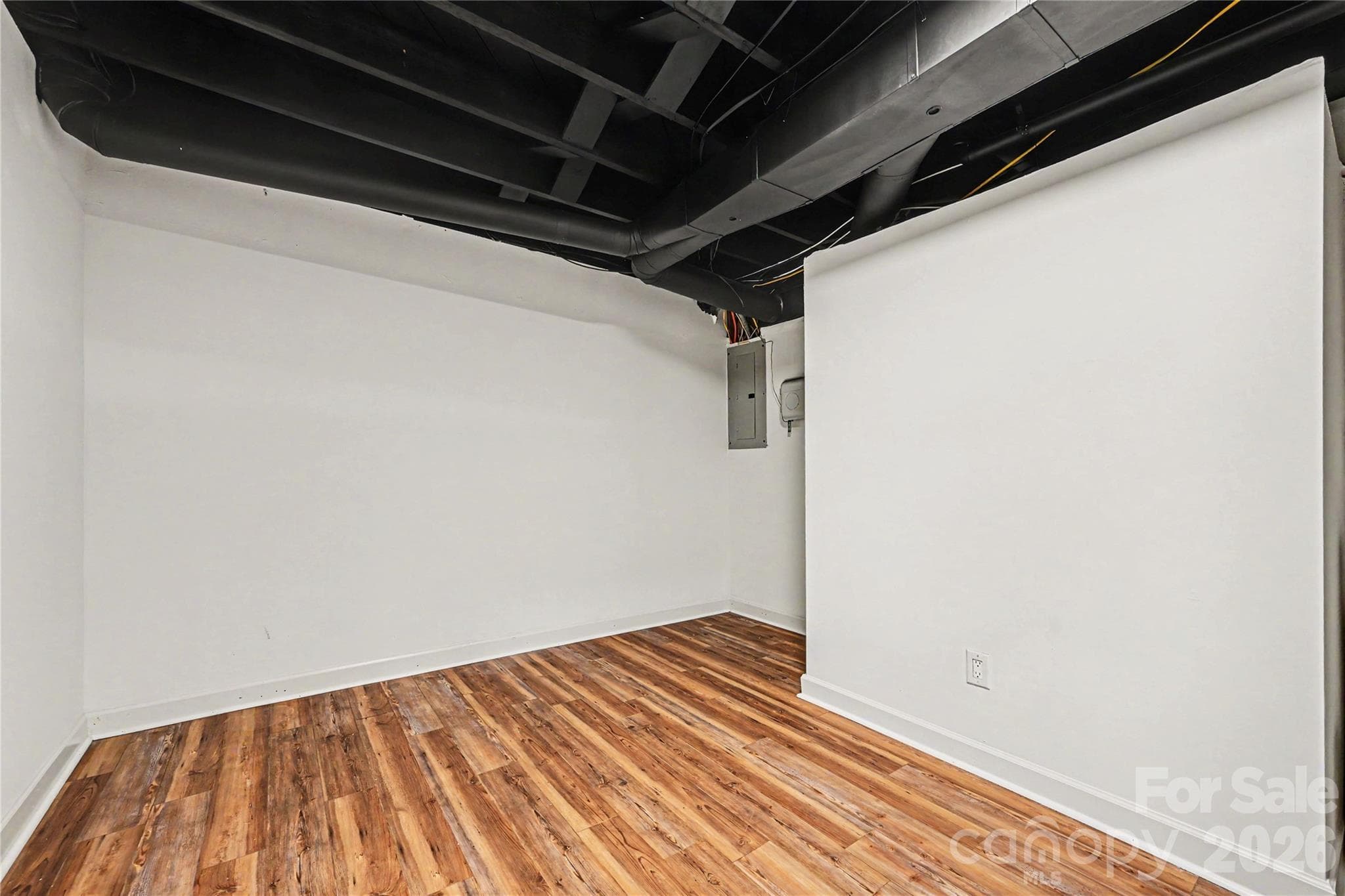 Private lower level flex room perfect for a home office, gym, hobby room, craft space, or additional recreation area. - Concord