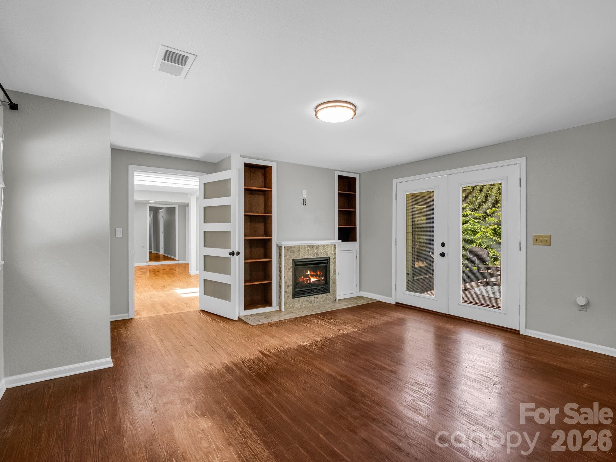 Family Room off of Living Room, with gas logs Fireplace (fire digitally added) - 35 Chastain Hill Road, Mills River
