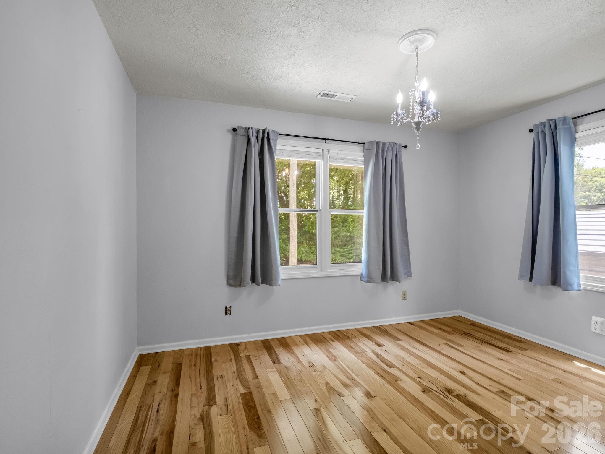 Guest Bedroom located off of main hallway - virtually staged - 35 Chastain Hill Road, Mills River