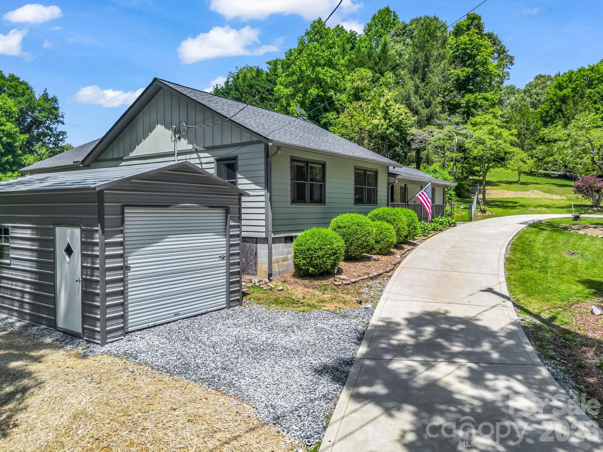 Oversized storage building to left of home. Large enough to garage a smaller vehicles - 35 Chastain Hill Road, Mills River