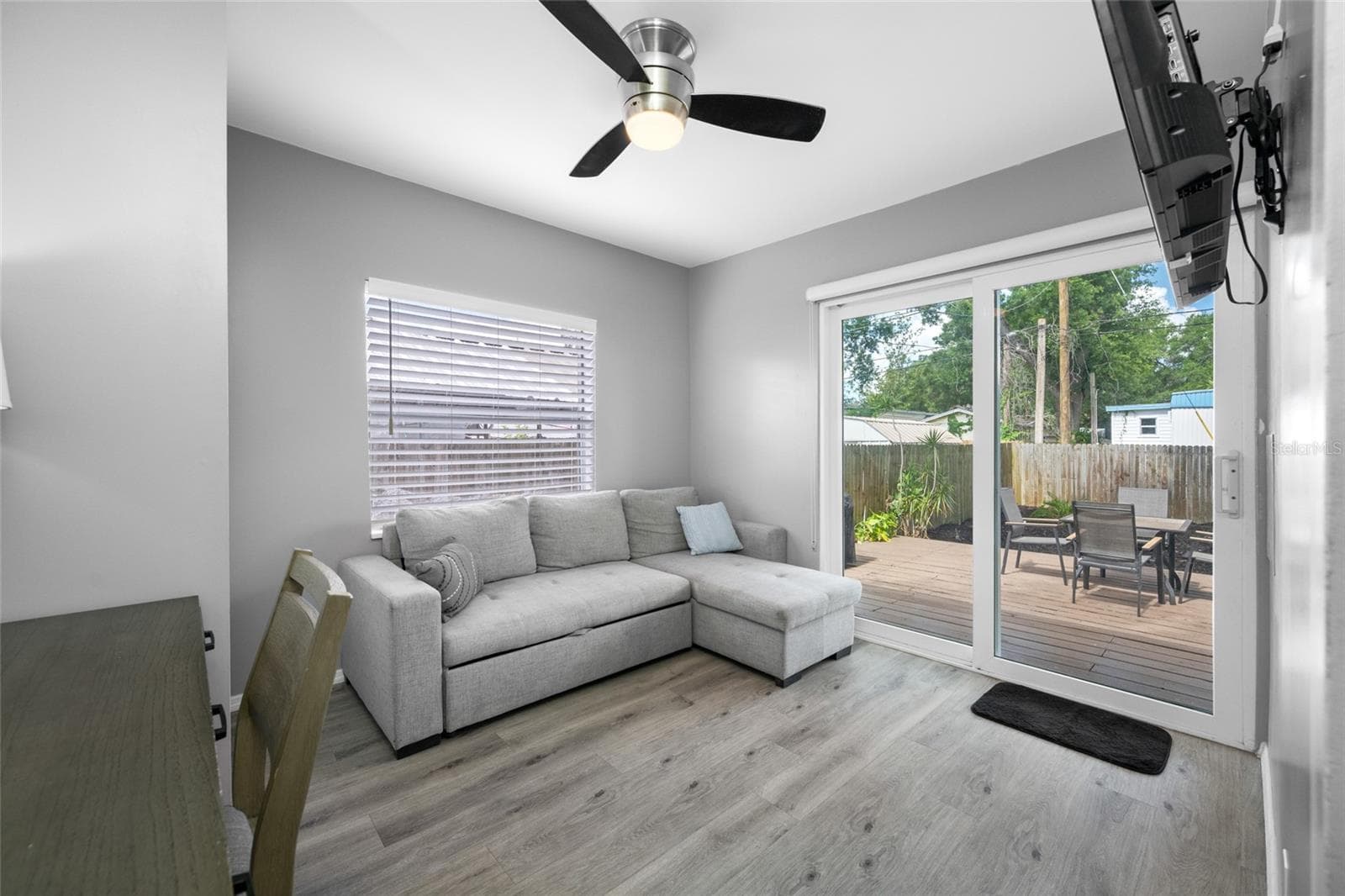 Bedroom 3 / Office with built in closet and slider opening to the back deck. - 5044 BETTY ST N, ST PETERSBURG